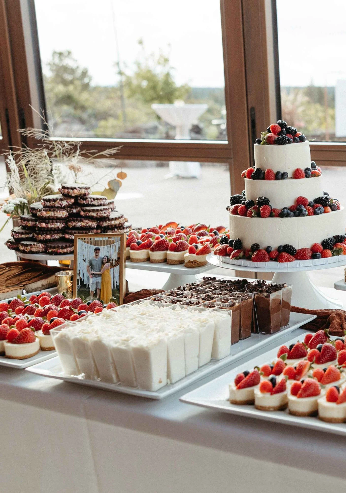 3-tier-cheesecake-with-dessert-table.jpg