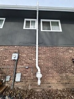 Marshfield MO radon mitigation system on the exterior of home.