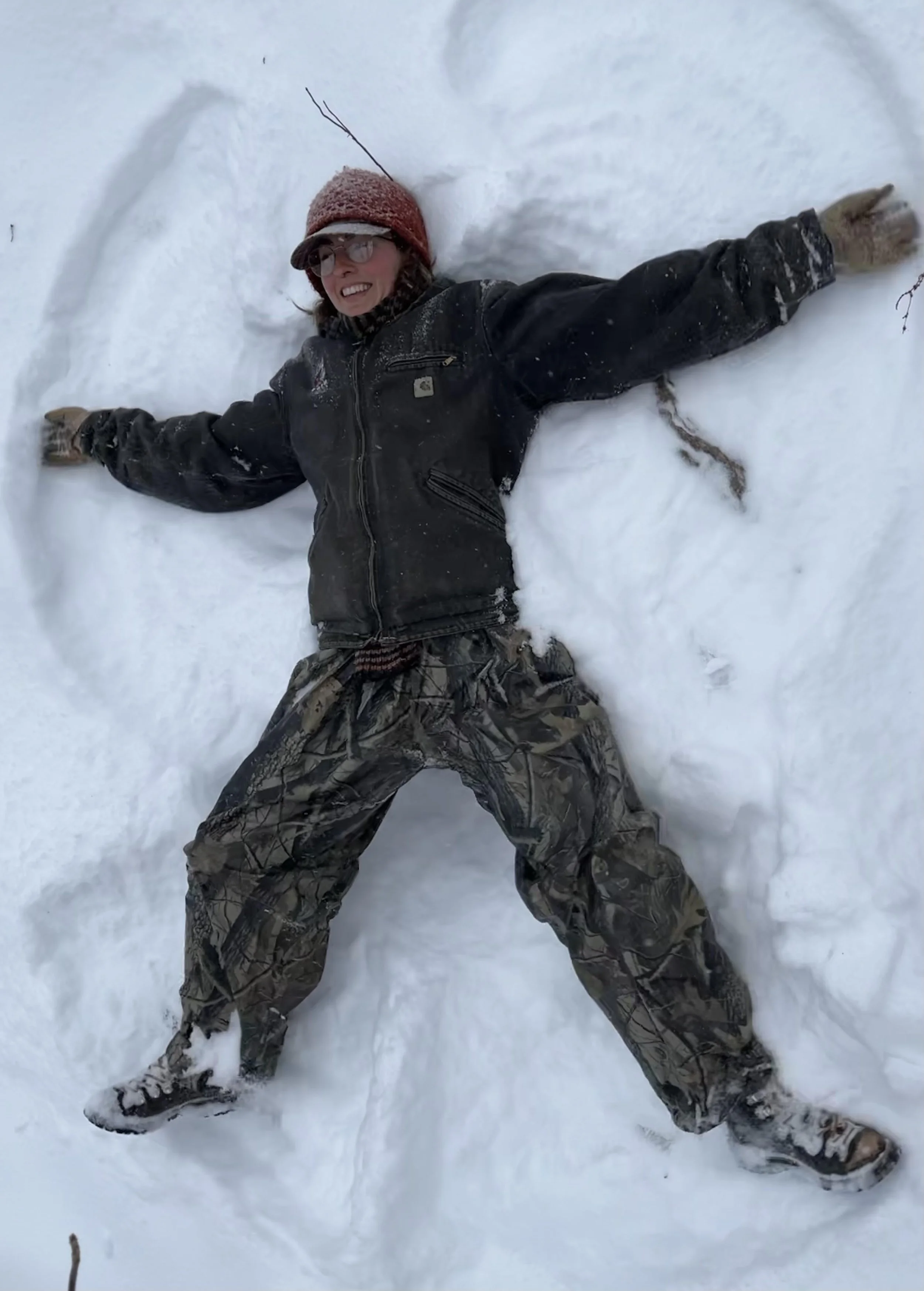 Ava making a snow angel