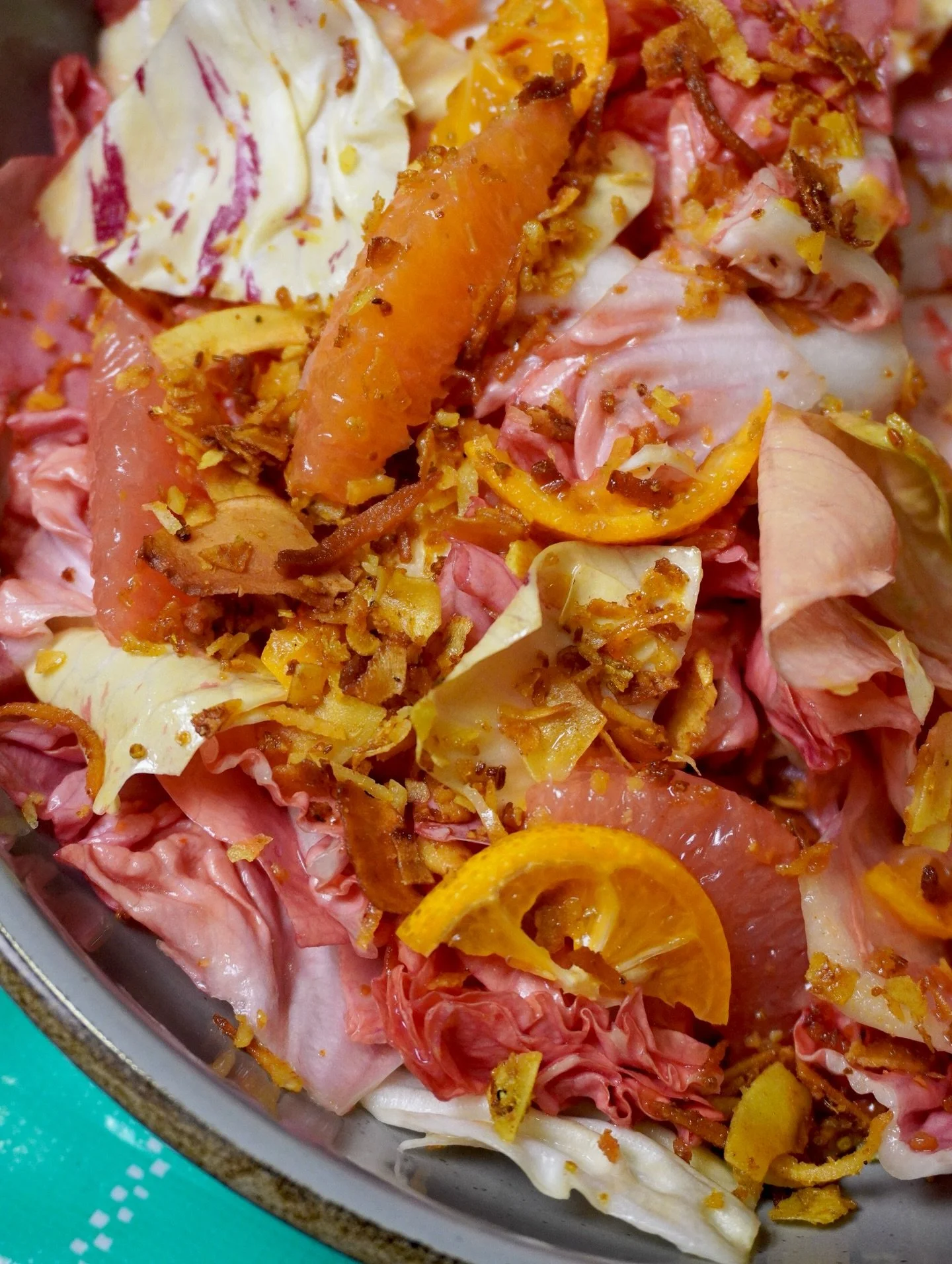 Citrus and chicories are some of our favorite winter produce to play with, and we made this dish to let them shine! Pink Chicory from @flyingcoyotefarm, centennial kumquats, rio star grapefruit, and cara cara orange all dressed up in a roasted garlic