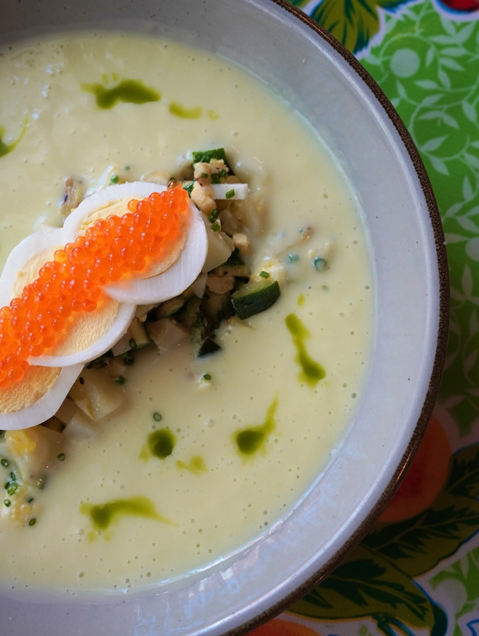 Meet our new warm weather soup: Zucchini Okroshka. 🥒

A summery take on the classic chilled kefir soup, with grilled and pickled squashes, potatoes, hard-boiled egg, charred spring onion oil, and a little steelhead roe on top.

Cool, tangy, smoky, b