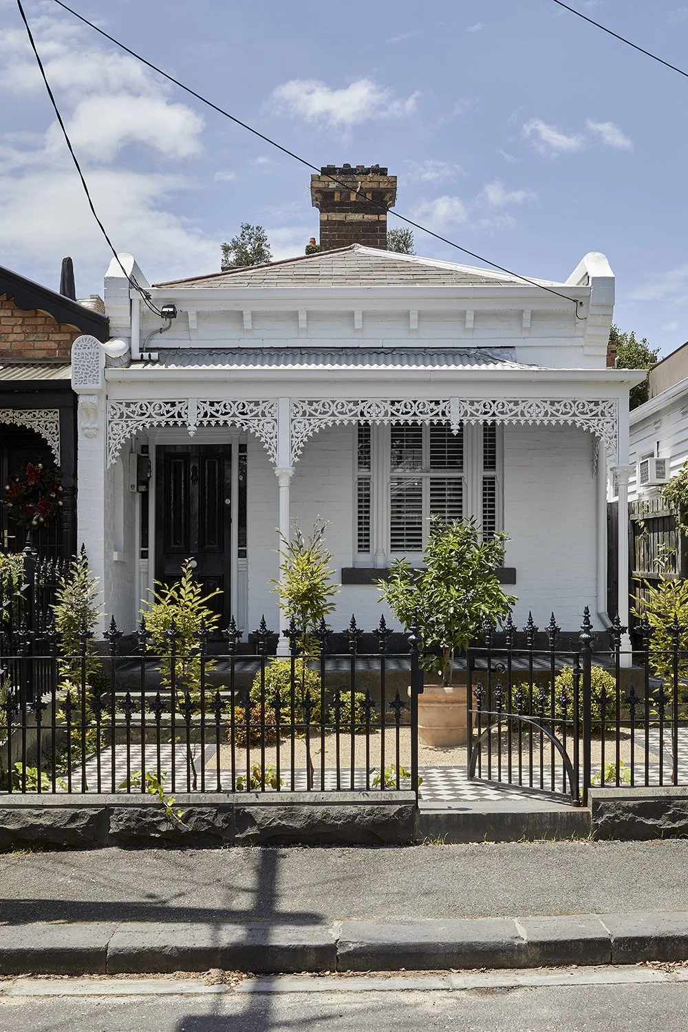 Restored single-fronted Victorian facade of South Yarra Residence with ornate detailing