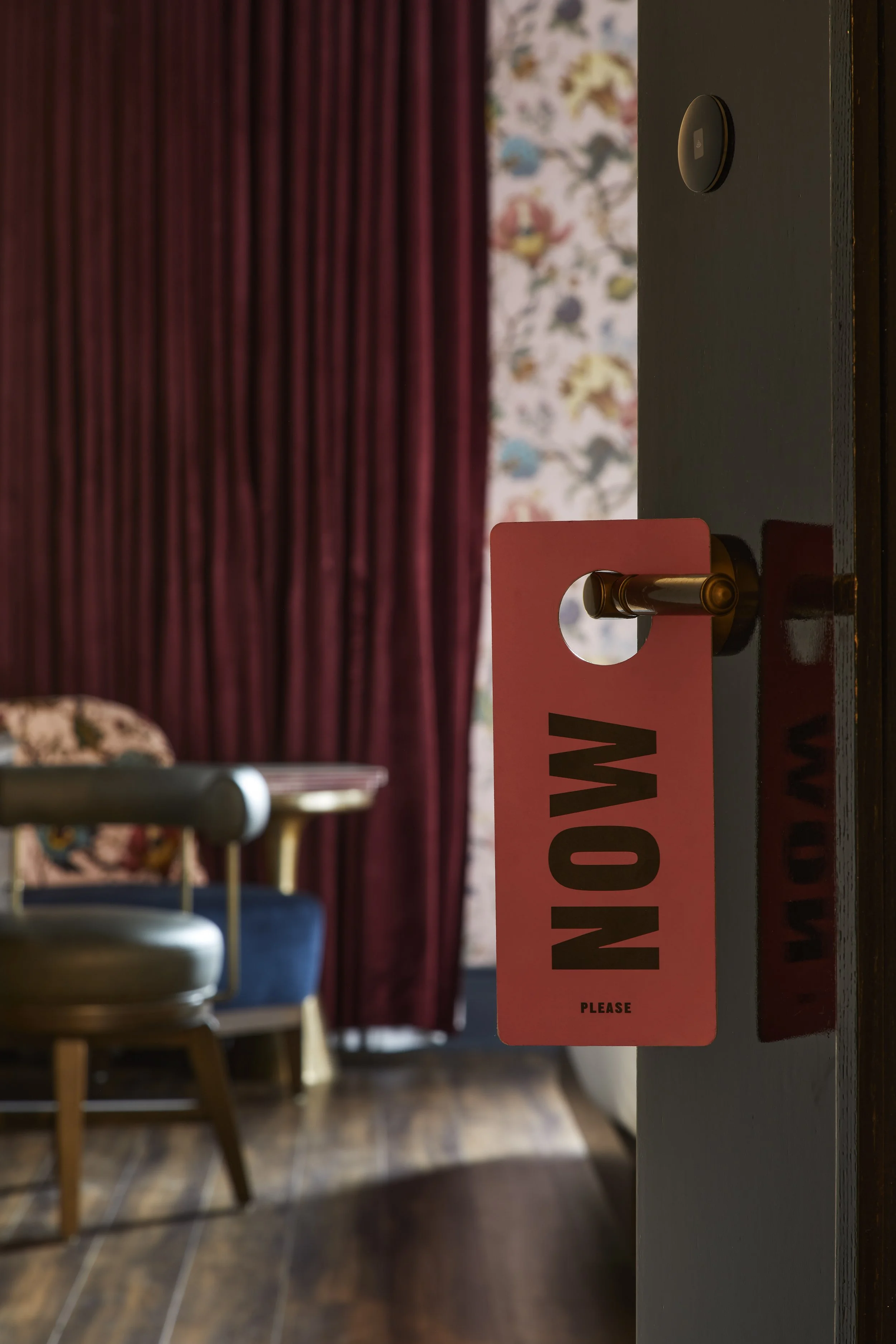 Opening the door viewpoint with a tag on the door handle that says 'Now'