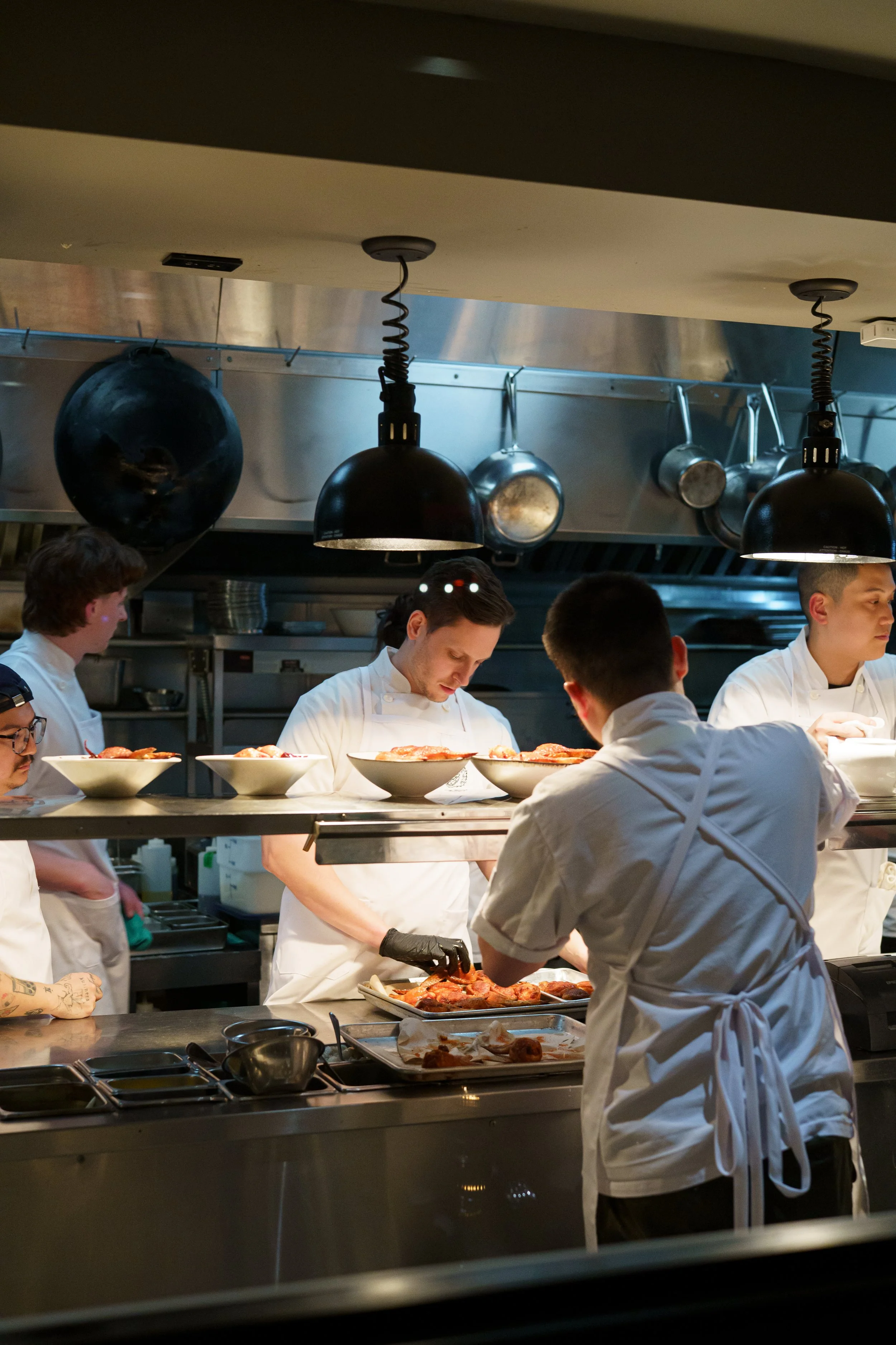 The view of inside a restaurant kitchen from the outside.