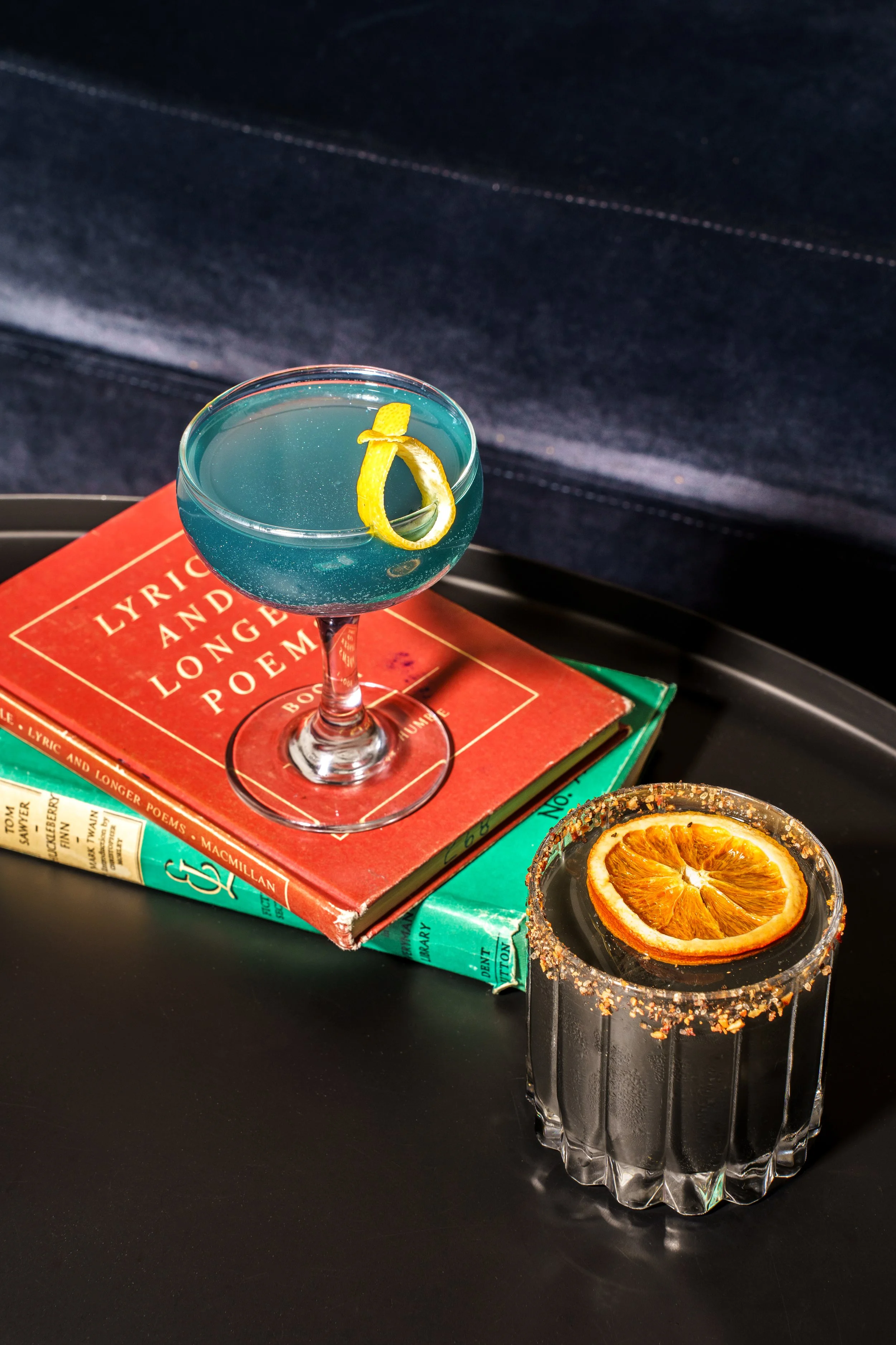 Two cocktails on two books.