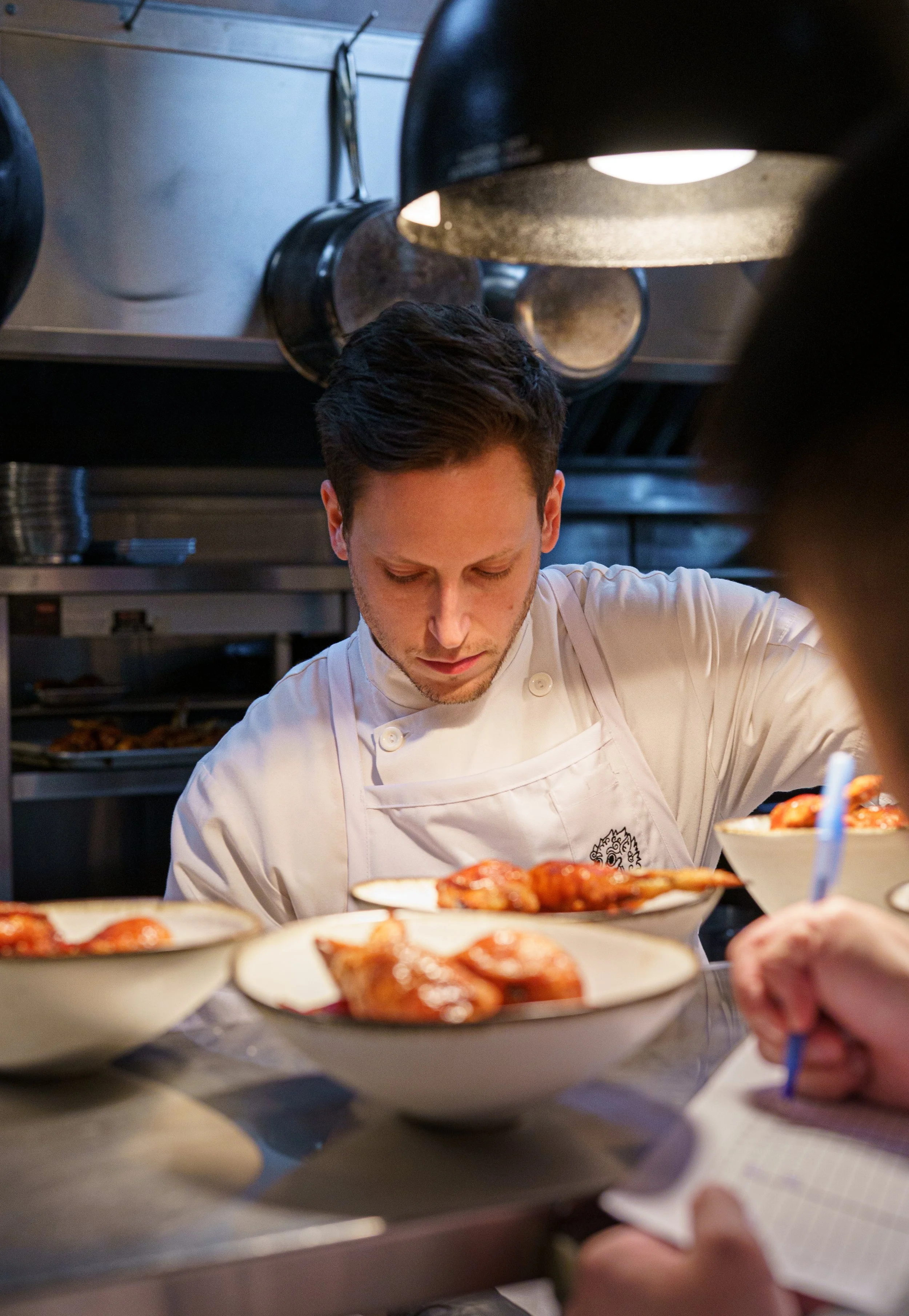 The view of inside a restaurant kitchen from the outside.