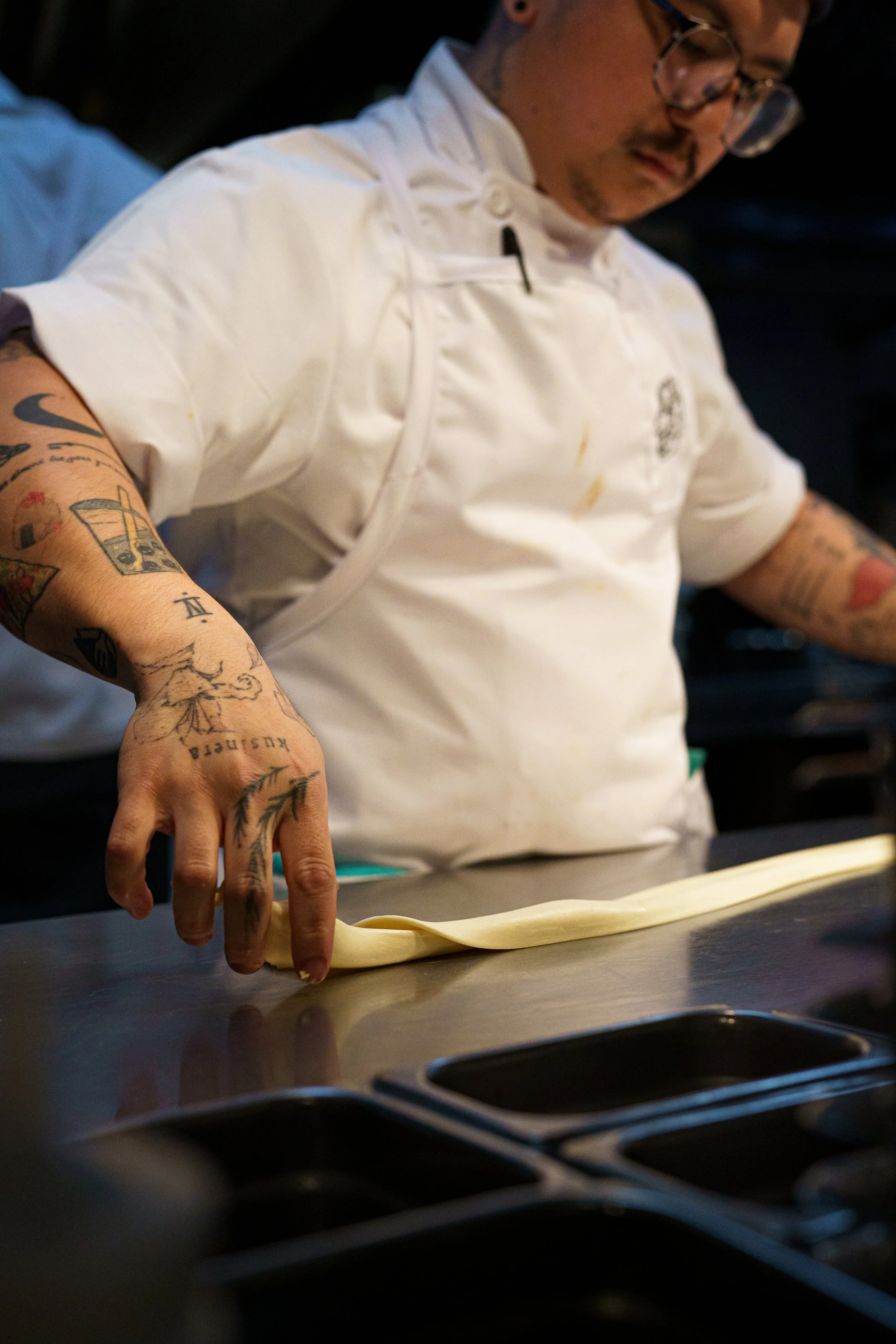 The view of inside a restaurant kitchen from the outside.