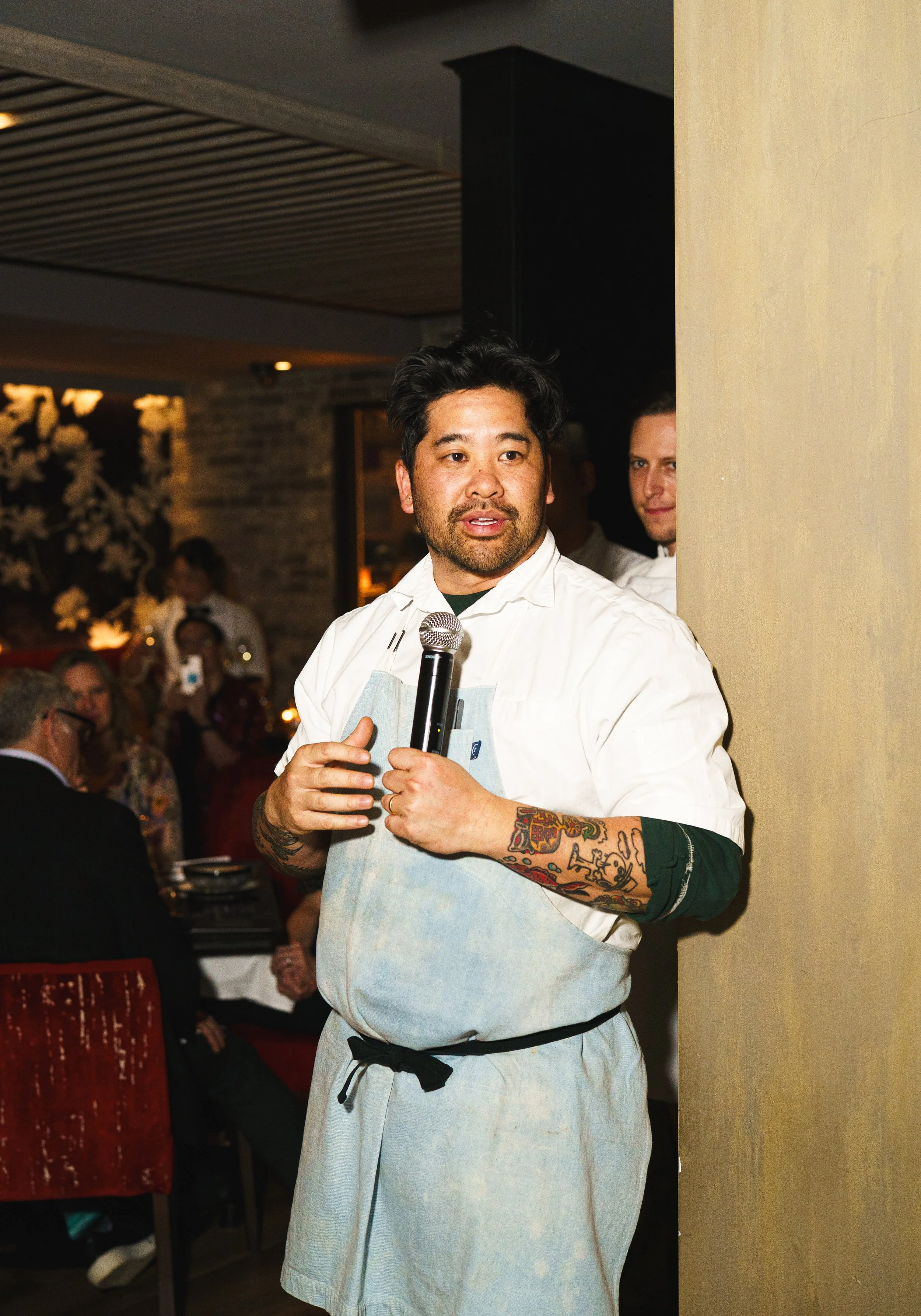 Someone making a speech in a restaurant