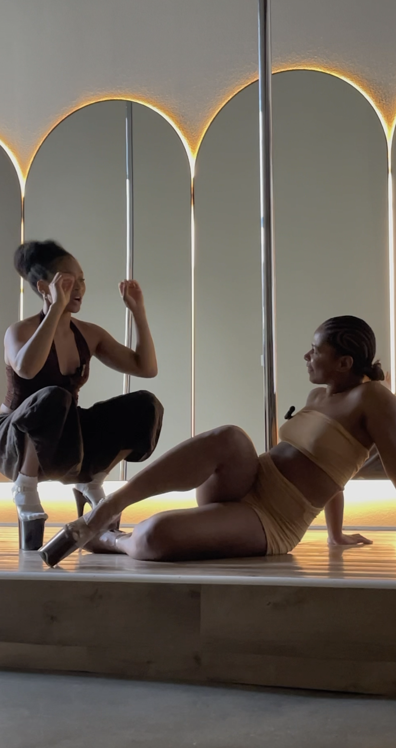 PoleBait founder Naya Somanya in a candid coaching moment with a student during a session at PoleBait Haus in Downtown Los Angeles