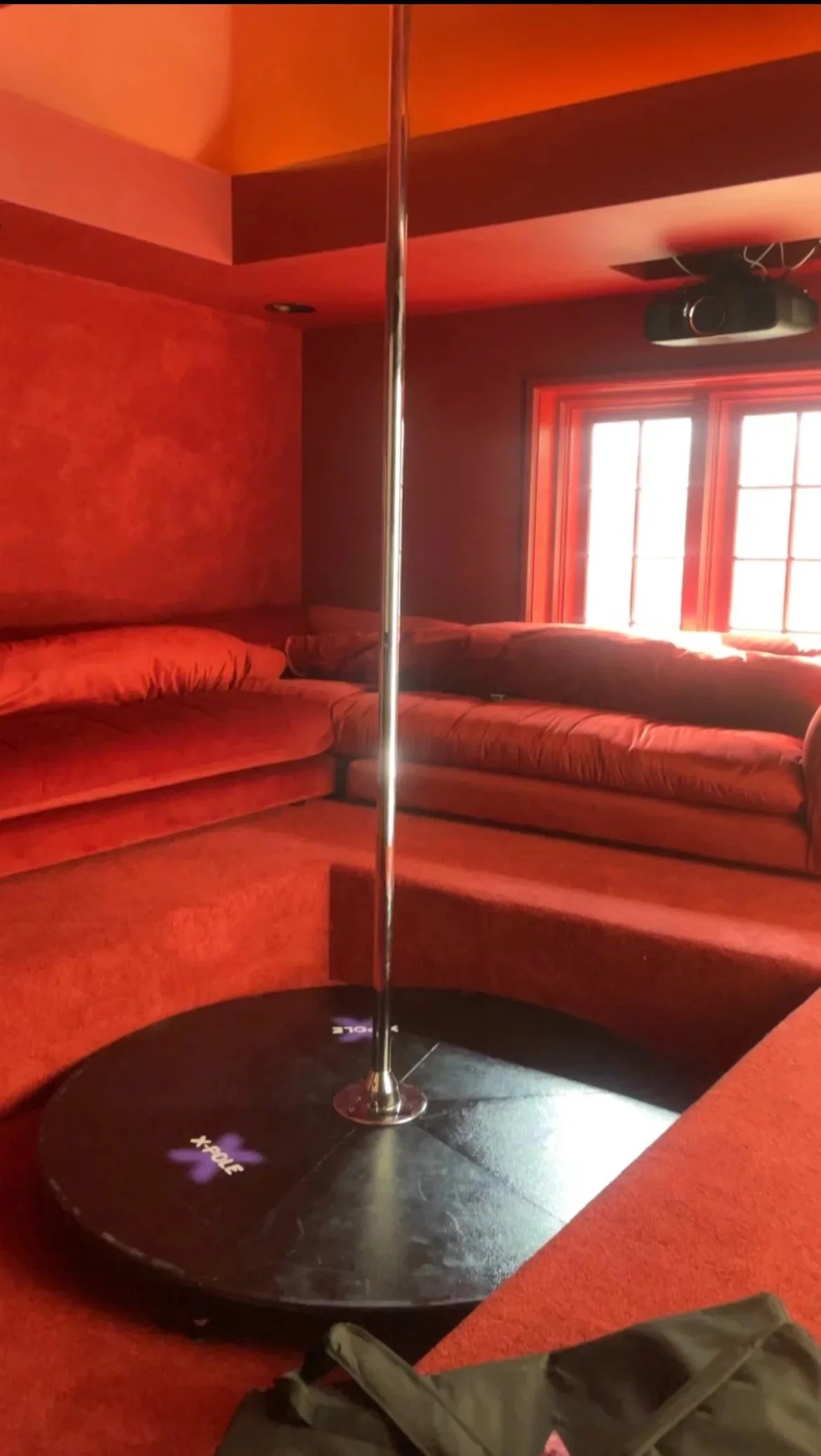 PoleBait stage pole rental setup at a retro movie theater for music video production in Los Angeles