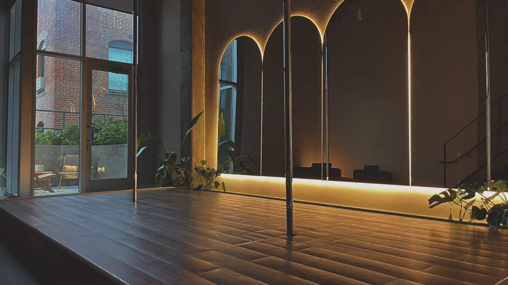 Warm amber lighting inside PoleBait Haus — private pole studio rental in Downtown Los Angeles for open pole sessions and content creation