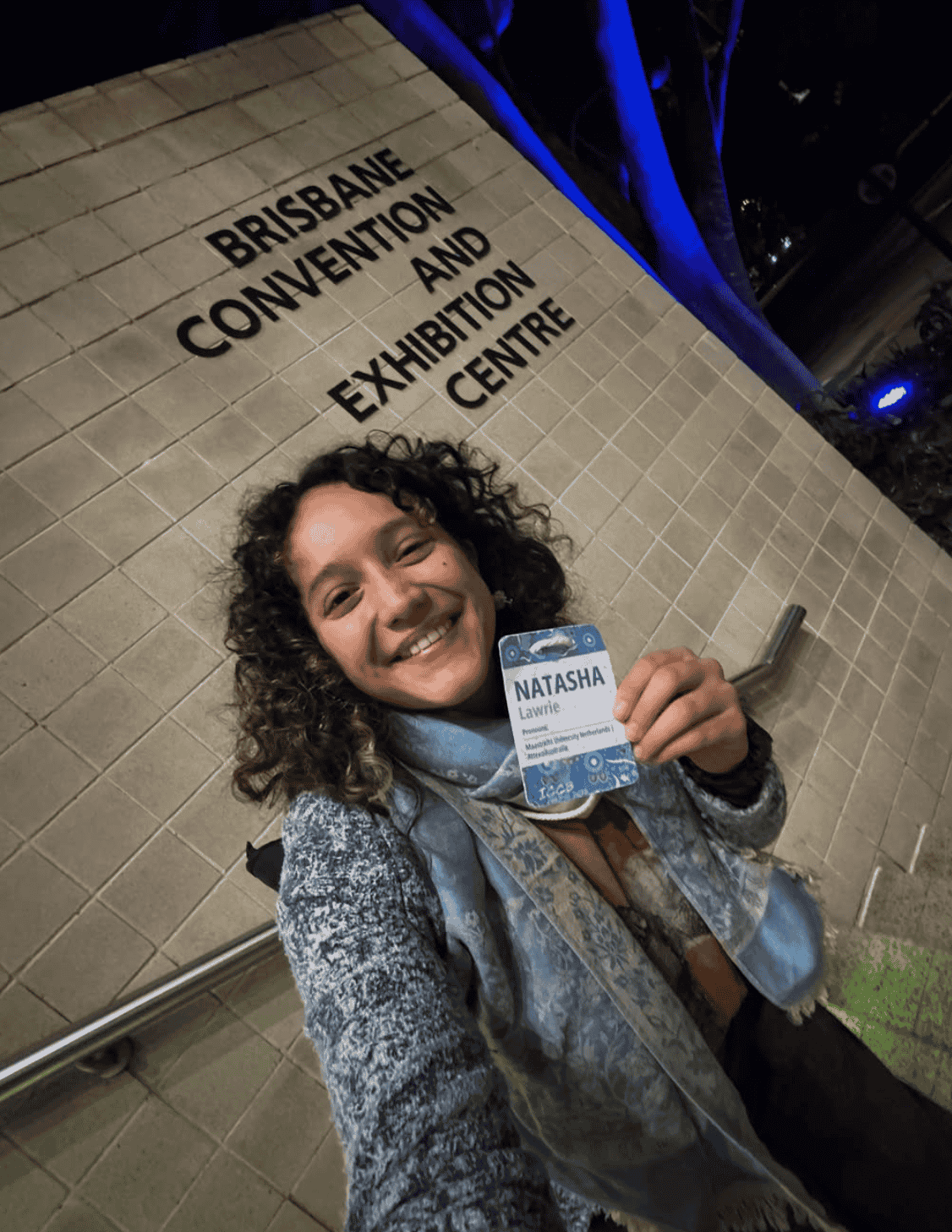 Guest wearing a plantable conference name tag.png
