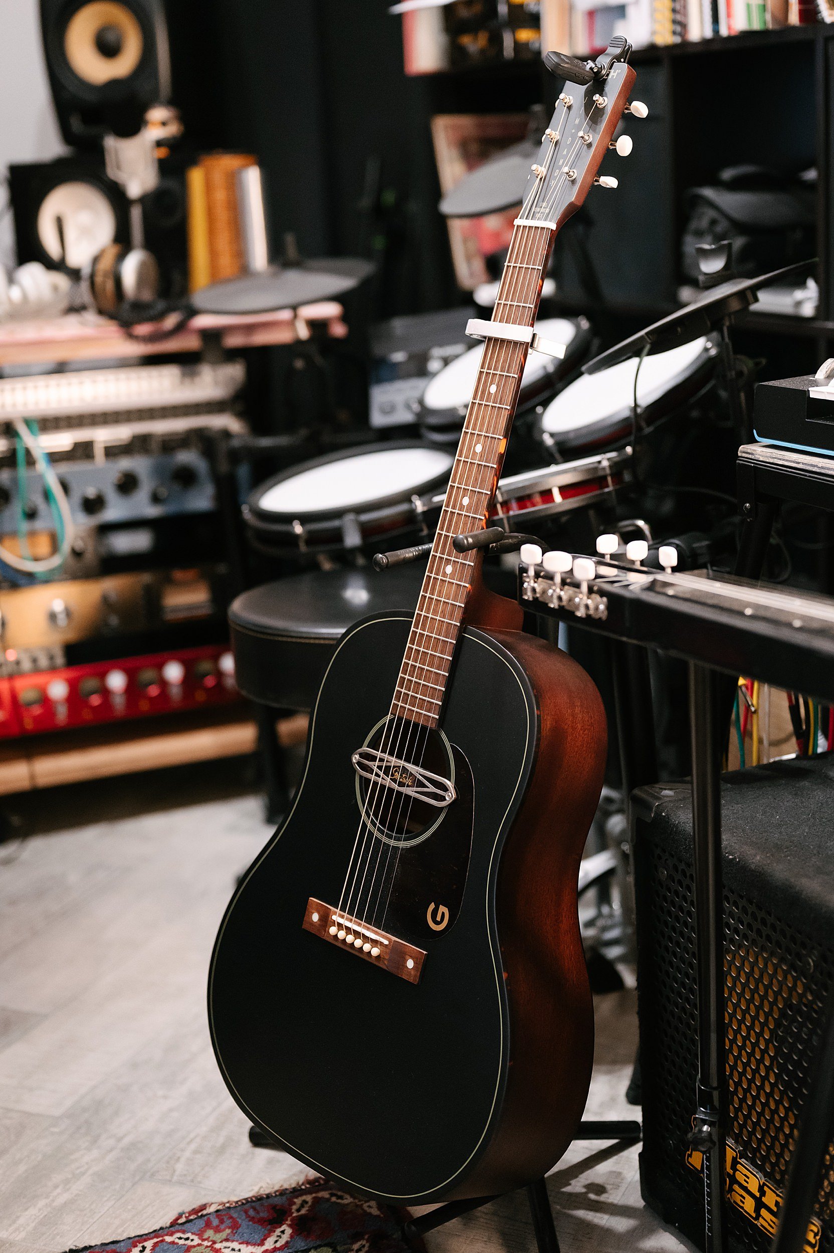 Vintage microphone and acoustic guitar studio details Akira Manera band photography