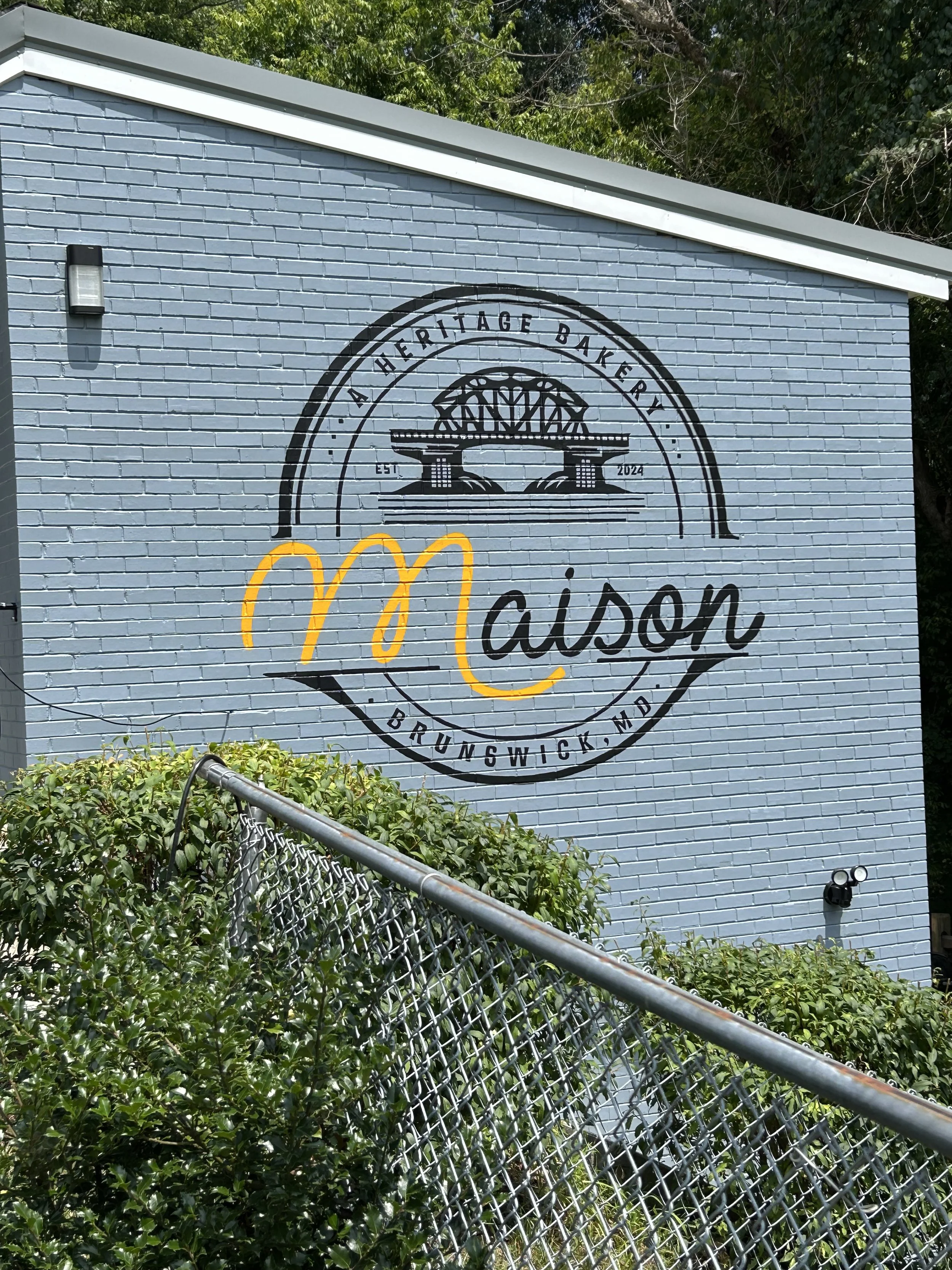Maison Bakery in Brunswick, MD- Hand painted  logo on exterior brick