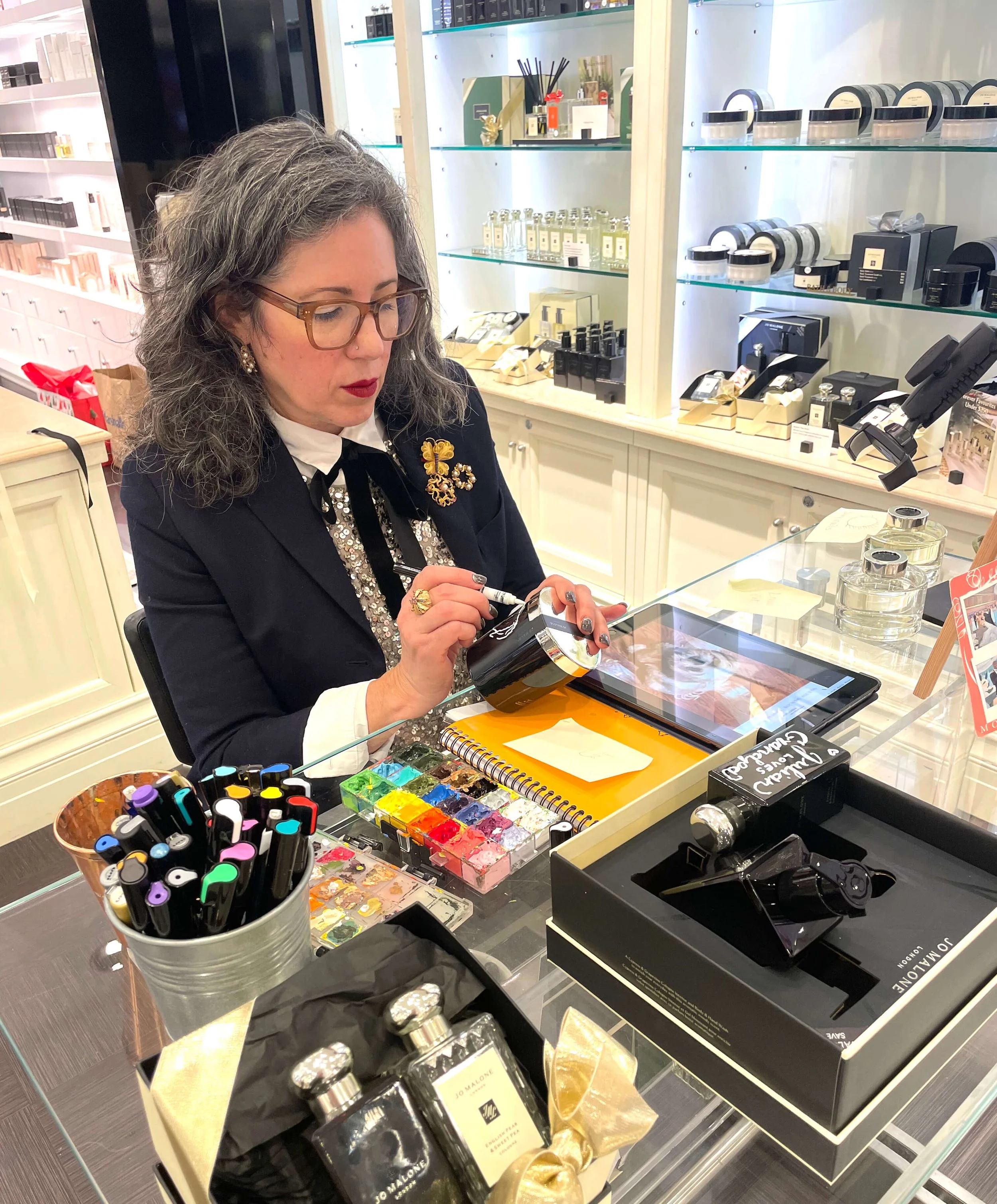 mollie fox painting at luxury brand event bloomingdales