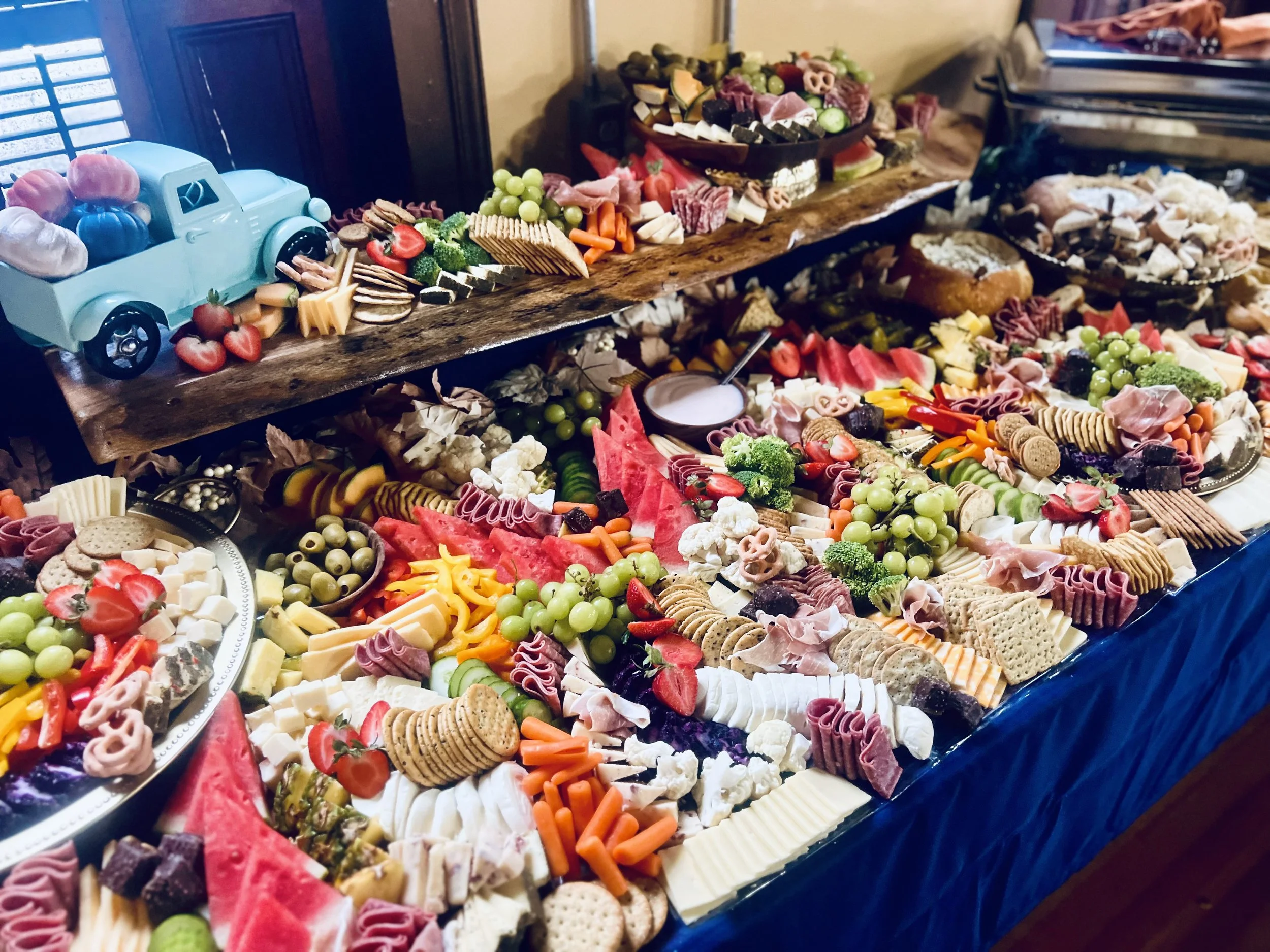 Charcuterie graze with meats, cheeses, fruits, vegetables, and seasonal treats by Mount Rose Event Co.