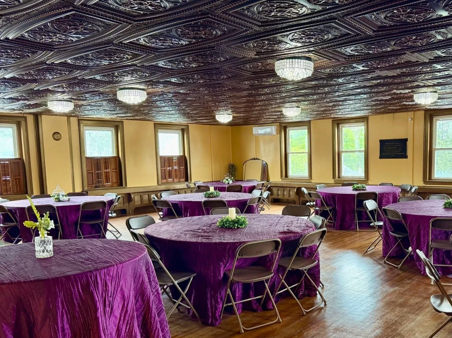 Regal purple tablecloths in the Banquet Room at The Relic.