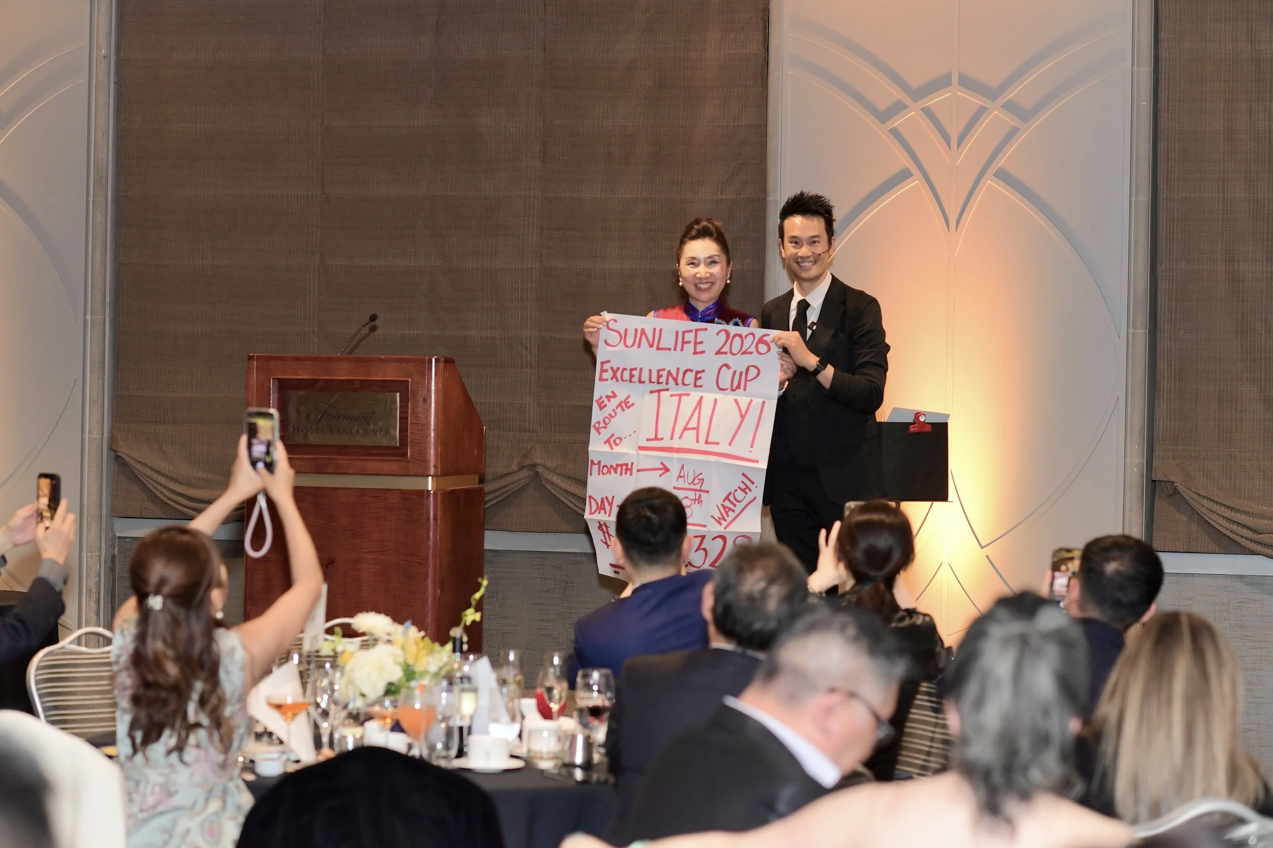 Corporate magician and MC Kel Ng performing stage magic show for 120 guests at Sun Life Financial awards night Fairmont Hotel Vancouver