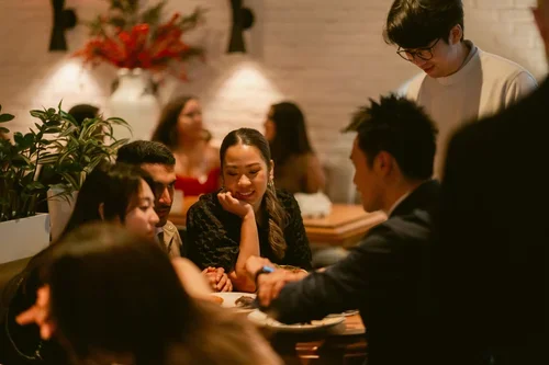 Close-up magic is intimate, engaging, fun, and high-energy.  Shot taken at Earls at the loft in Vancouver Yaletown.webp