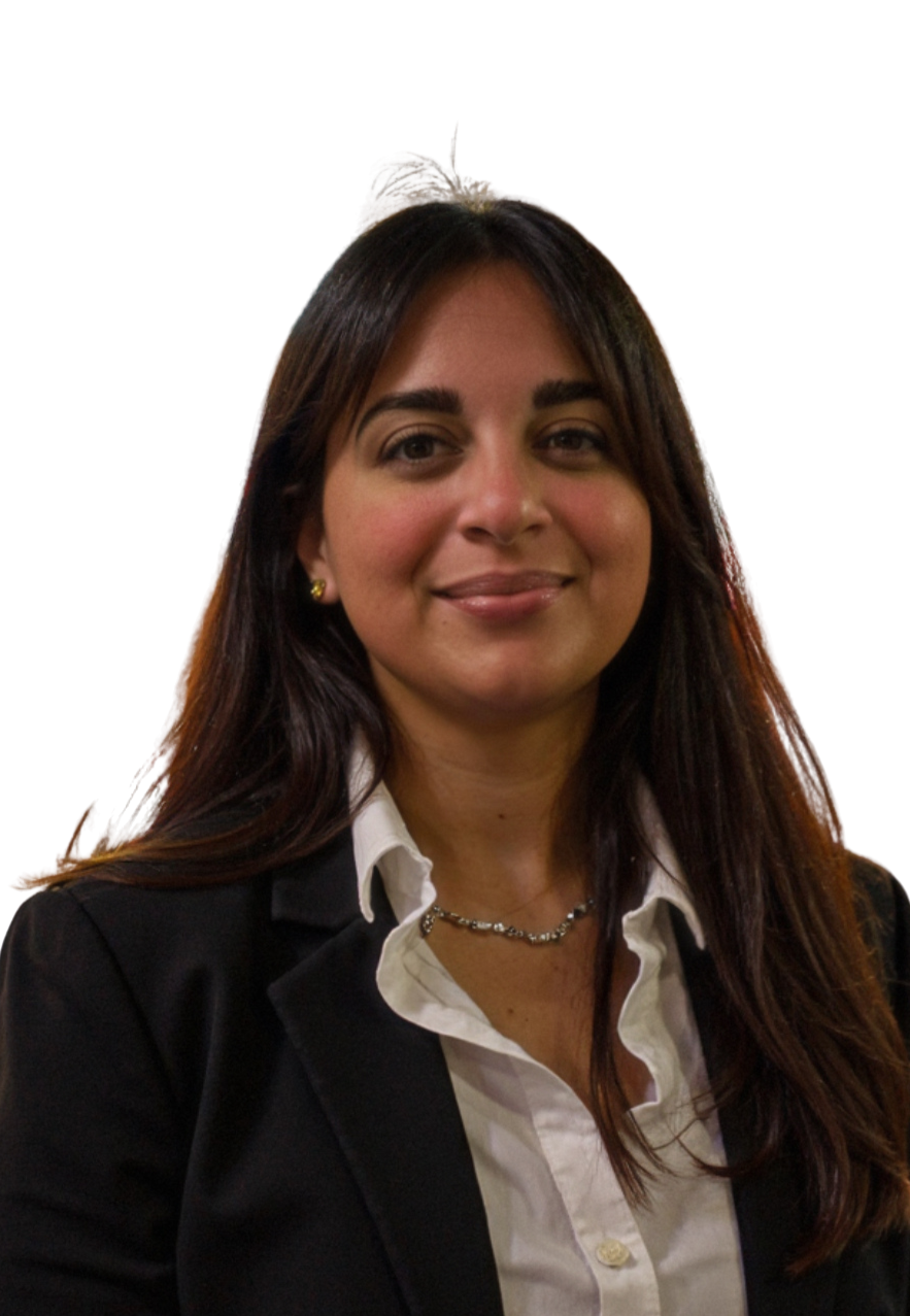Headshot of a smiling woman with long dark hair wearing a white sweater, against a white background.