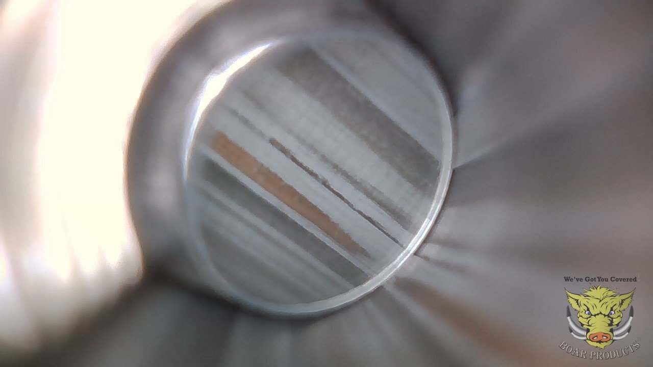 Borescope view in gun barrel with copper and metal fouling before being cleaned with Boar Products Gun Cleaner and Lubricant