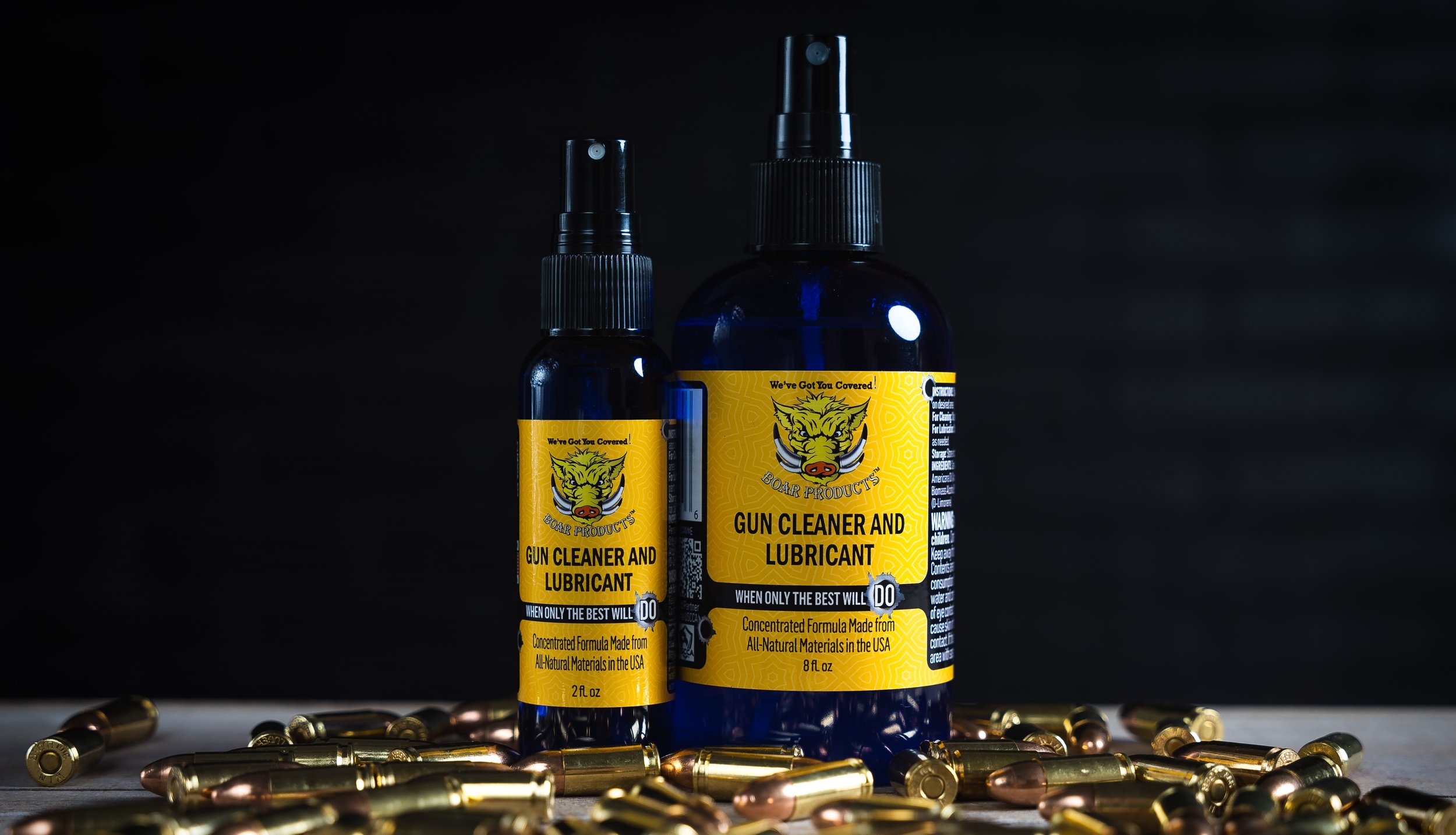 Photo of one 2 oz. bottle and one 8 oz. bottle of Boar Products Gun Cleaner and Lubricant side by side