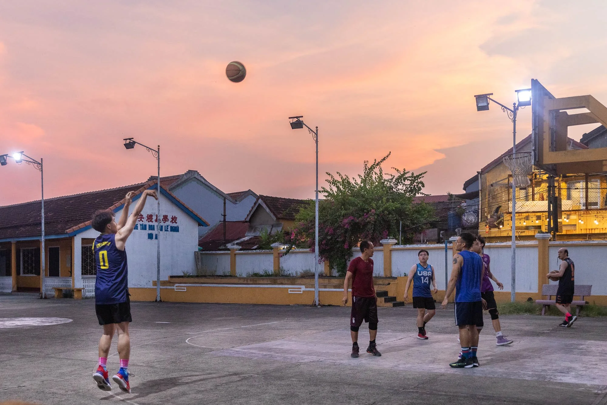 men-playing-basketball-hoi-ann-sunset.jpg
