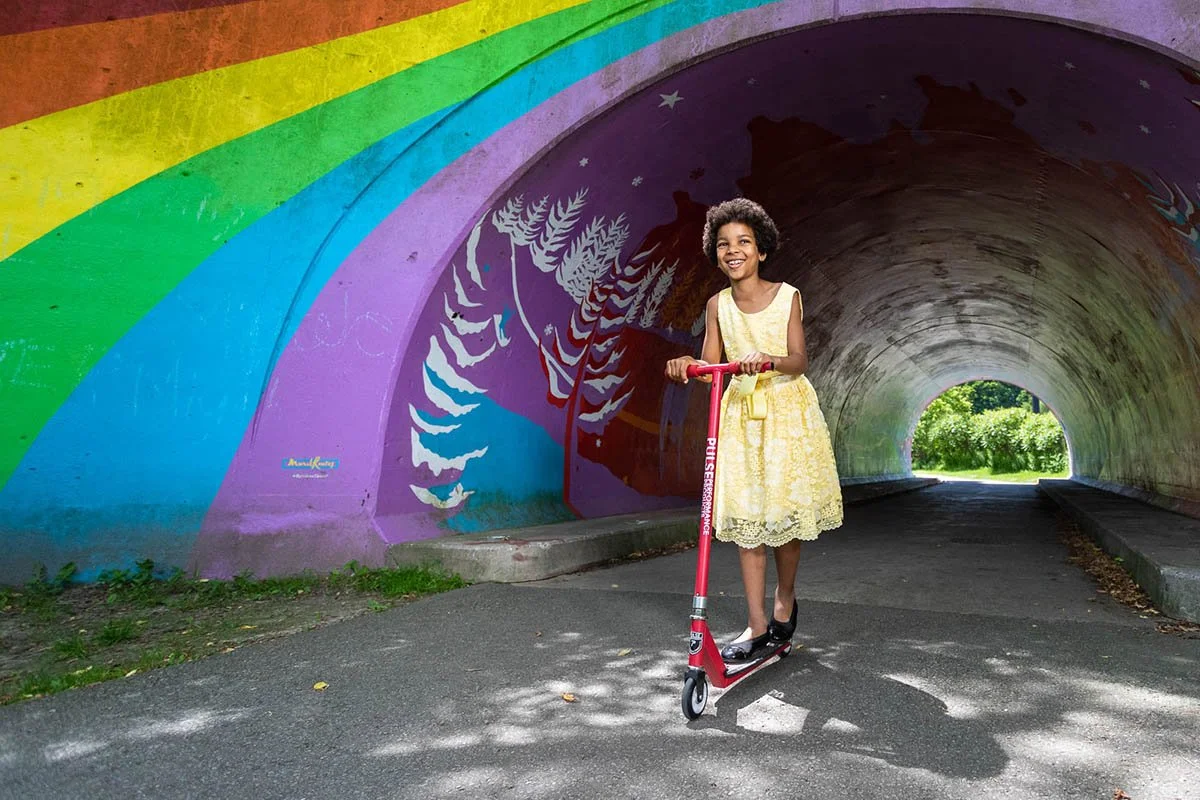 Nelly Arno participates in scooter and dance as part of a movement story.