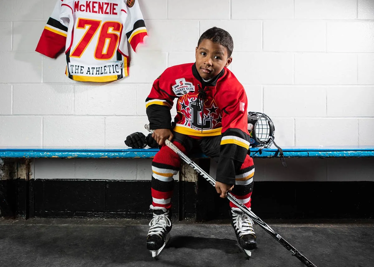 Ben McKenzie participates in hockey as part of a movement story.