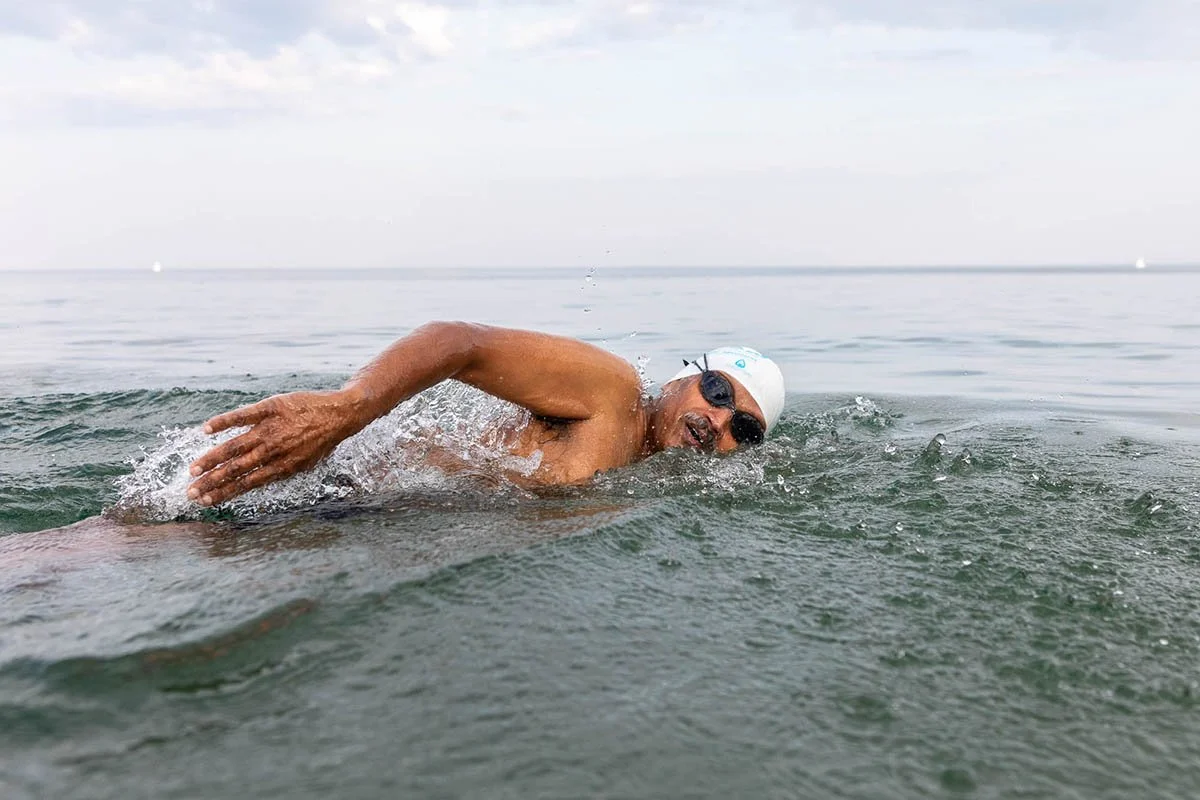 Madhu Nagaraja participates in open-water swimming and endurance sport as part of a movement story.