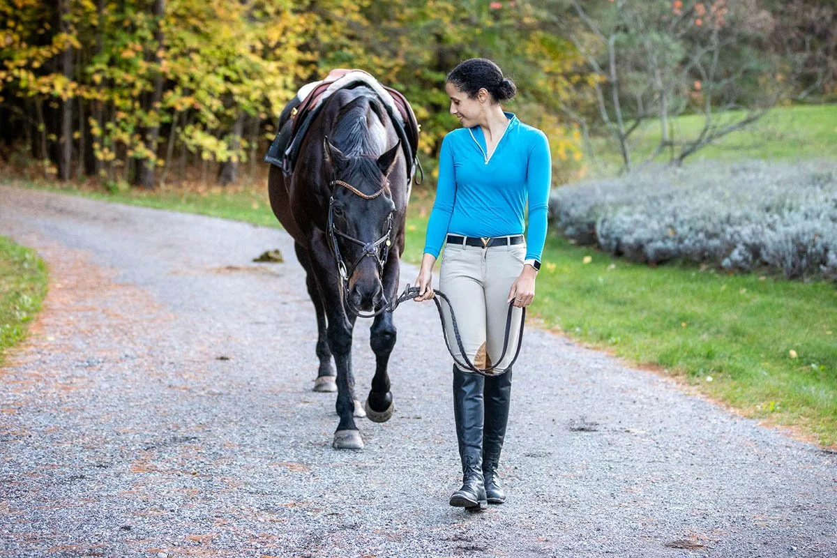 Jen walks Piper outdoors after riding to get fresh air and enjoy the scenery.