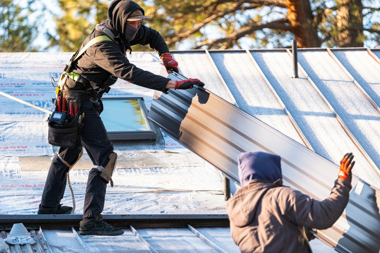 Metal roofing requires precision at every step. Our team works to carefully align and fasten everything, ensuring the roof performs as a unified system.