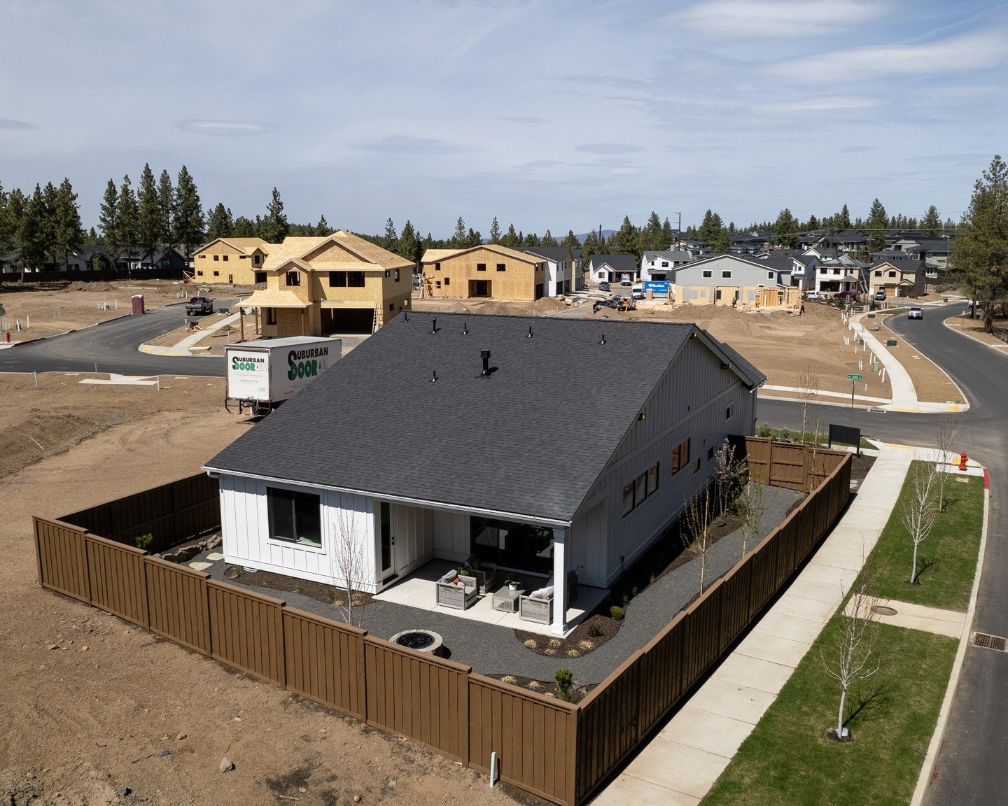 Bend keeps growing, and we're part of that story. While the next phase goes up in the background, this home is already ready for summer. That's the advantage of moving early; while others are still in the framing stage, you're already done. If your p
