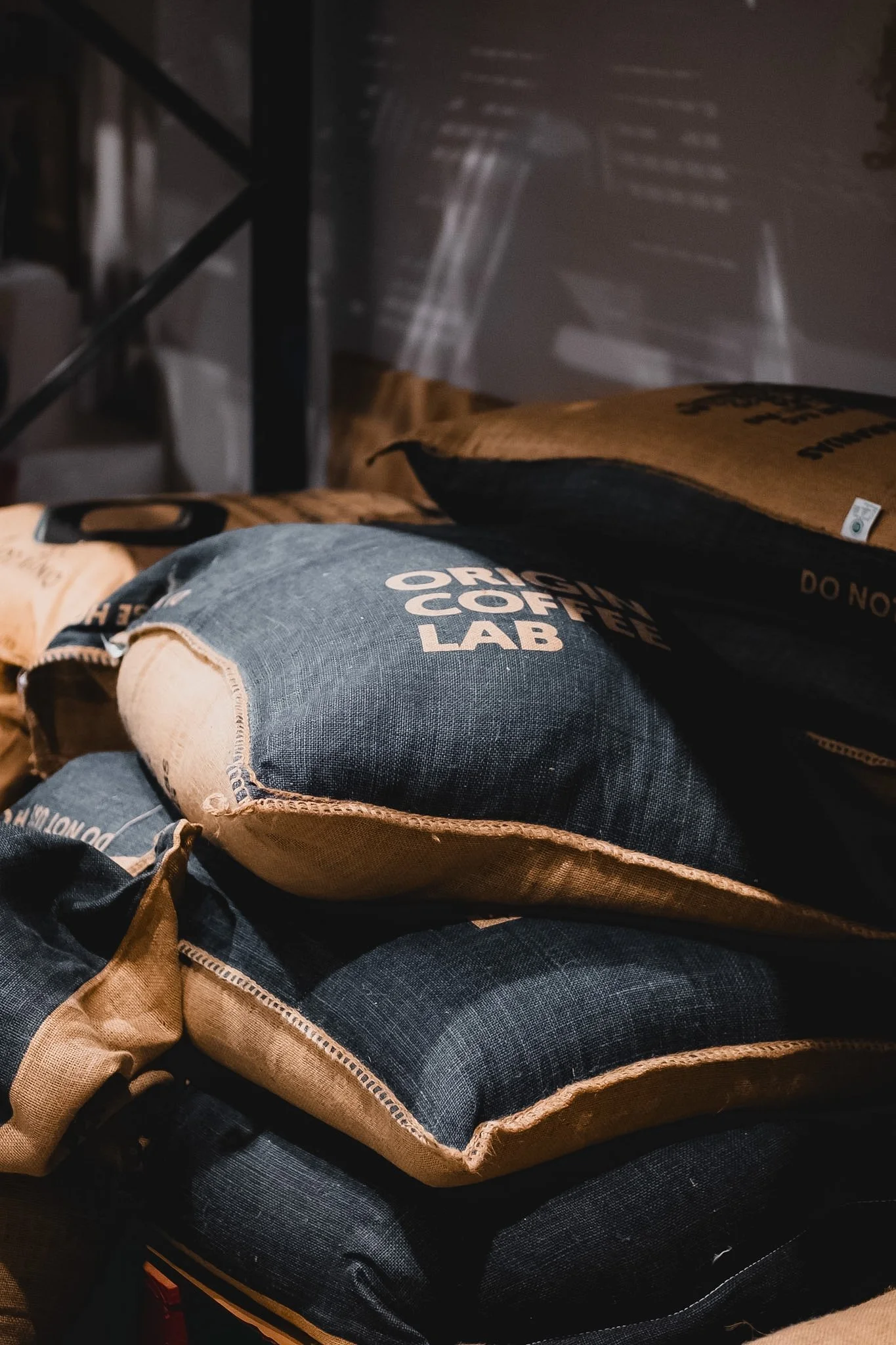 A photograph of burlap coffee sacks.