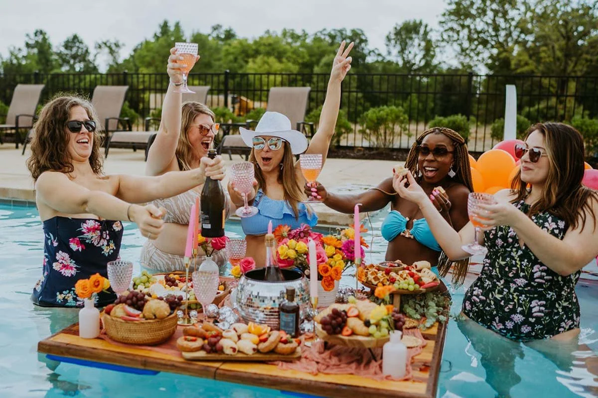 girlfriends-celerating-with-mimosas-and-floating-charctuerie-board.jpg