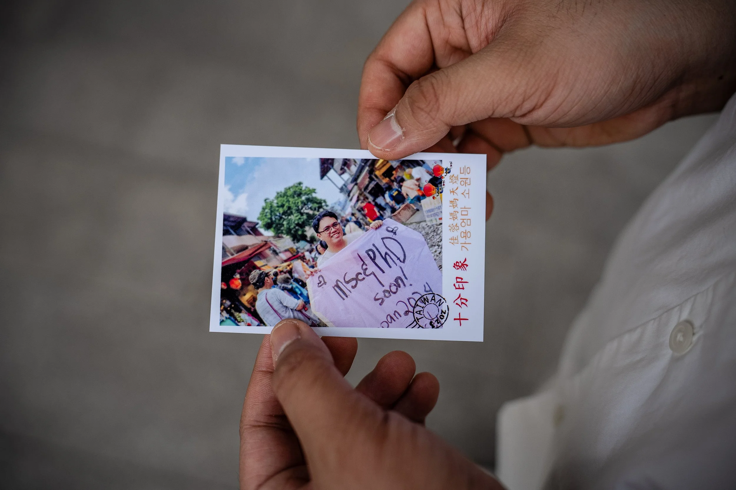 Jess Concepcion shows a photo of a sky lantern wish he made in Taiwan.