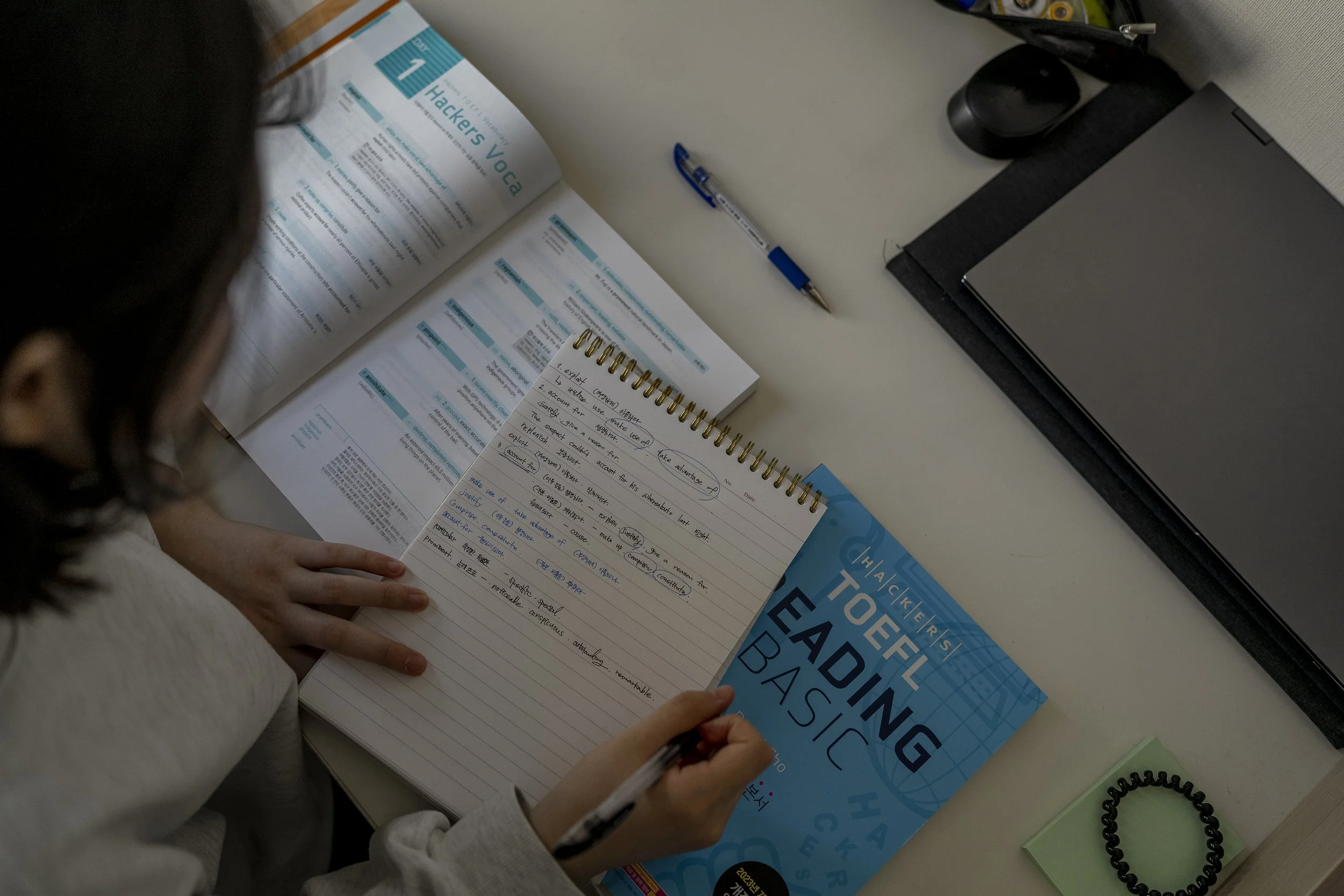 Seo Yeon* studies in her room at her home in Gimhae.