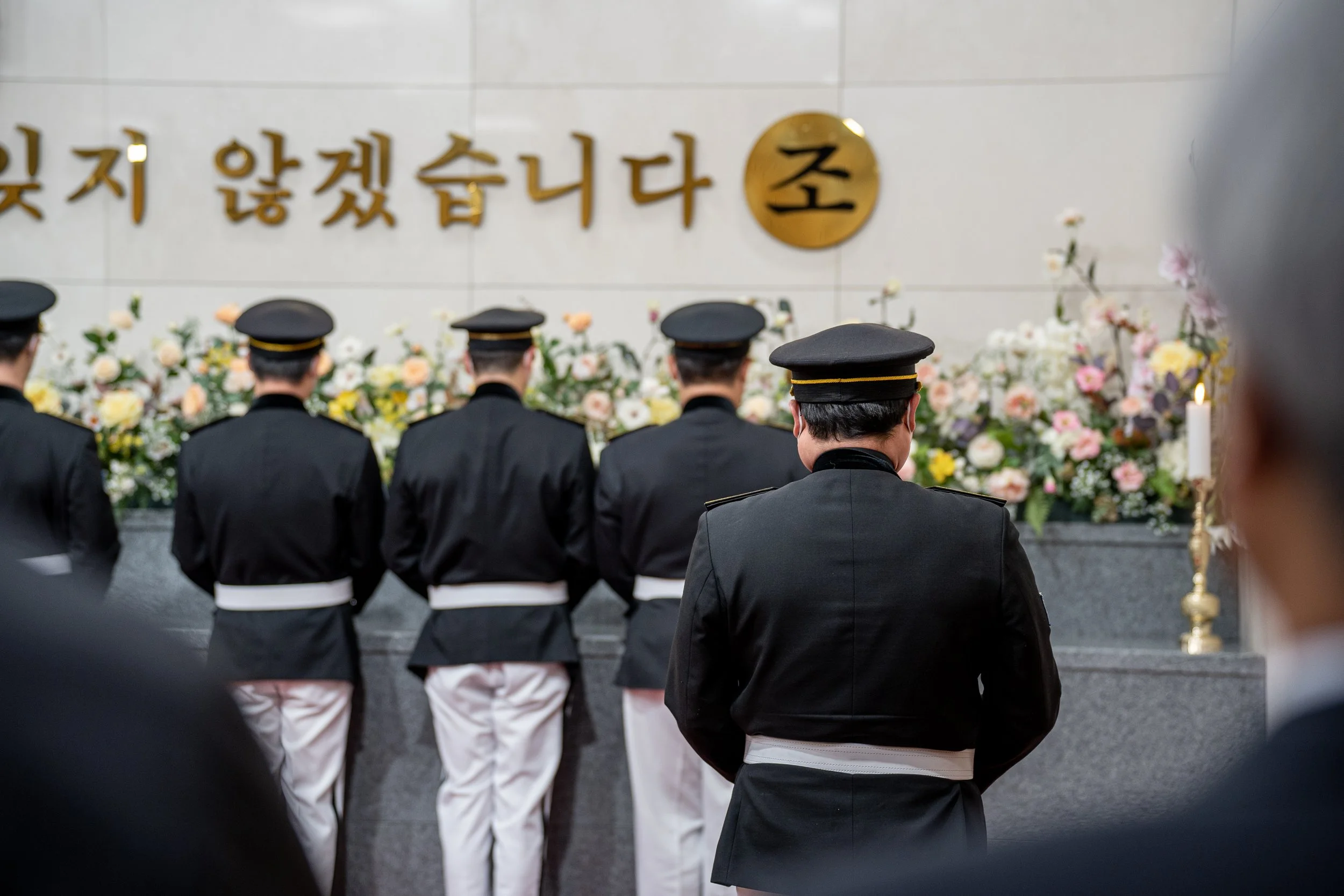 Honor guards carry urns at the reinterring ceremony at Daejeon National Cemetery.