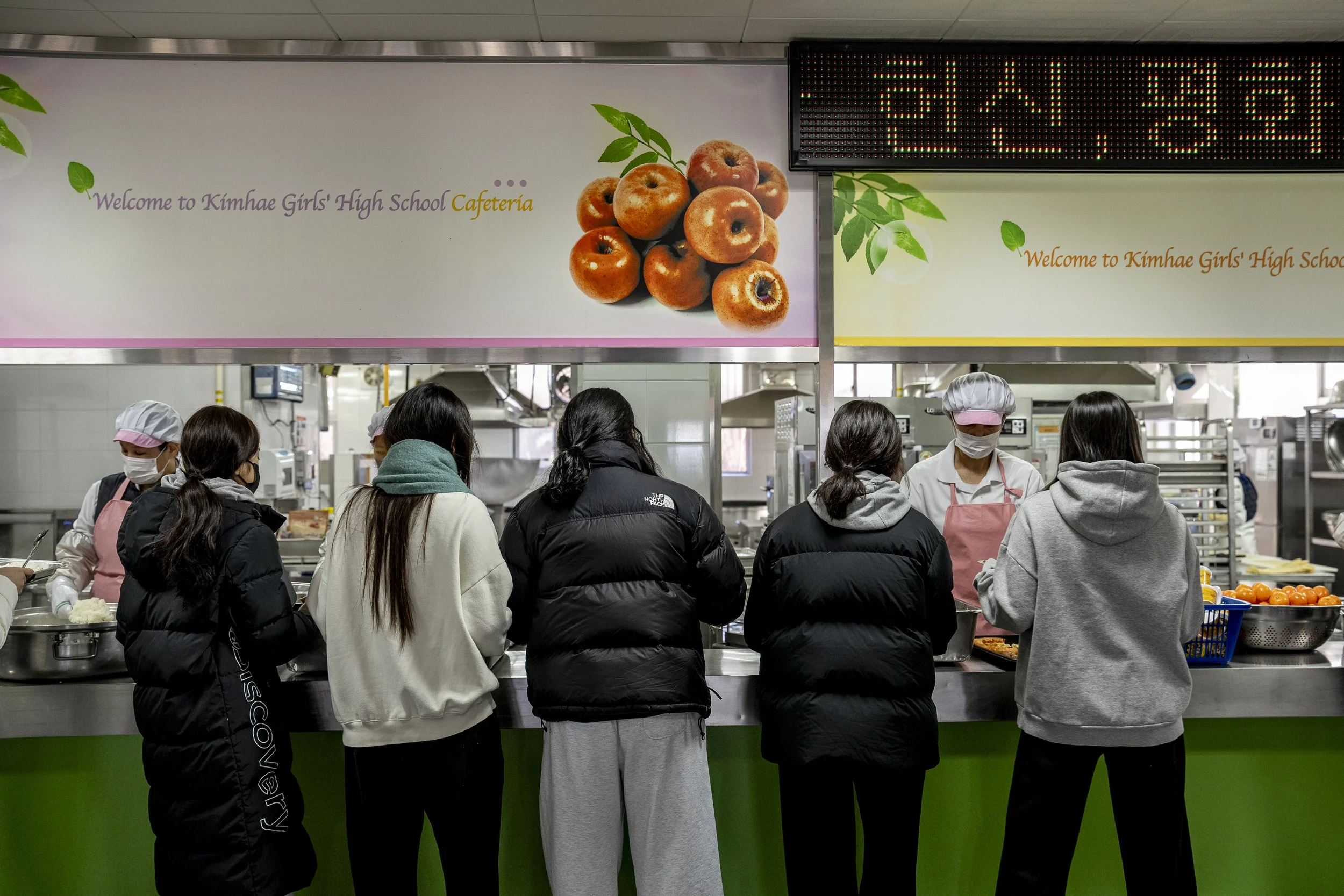 Students line up for lunch at the cafeteria.