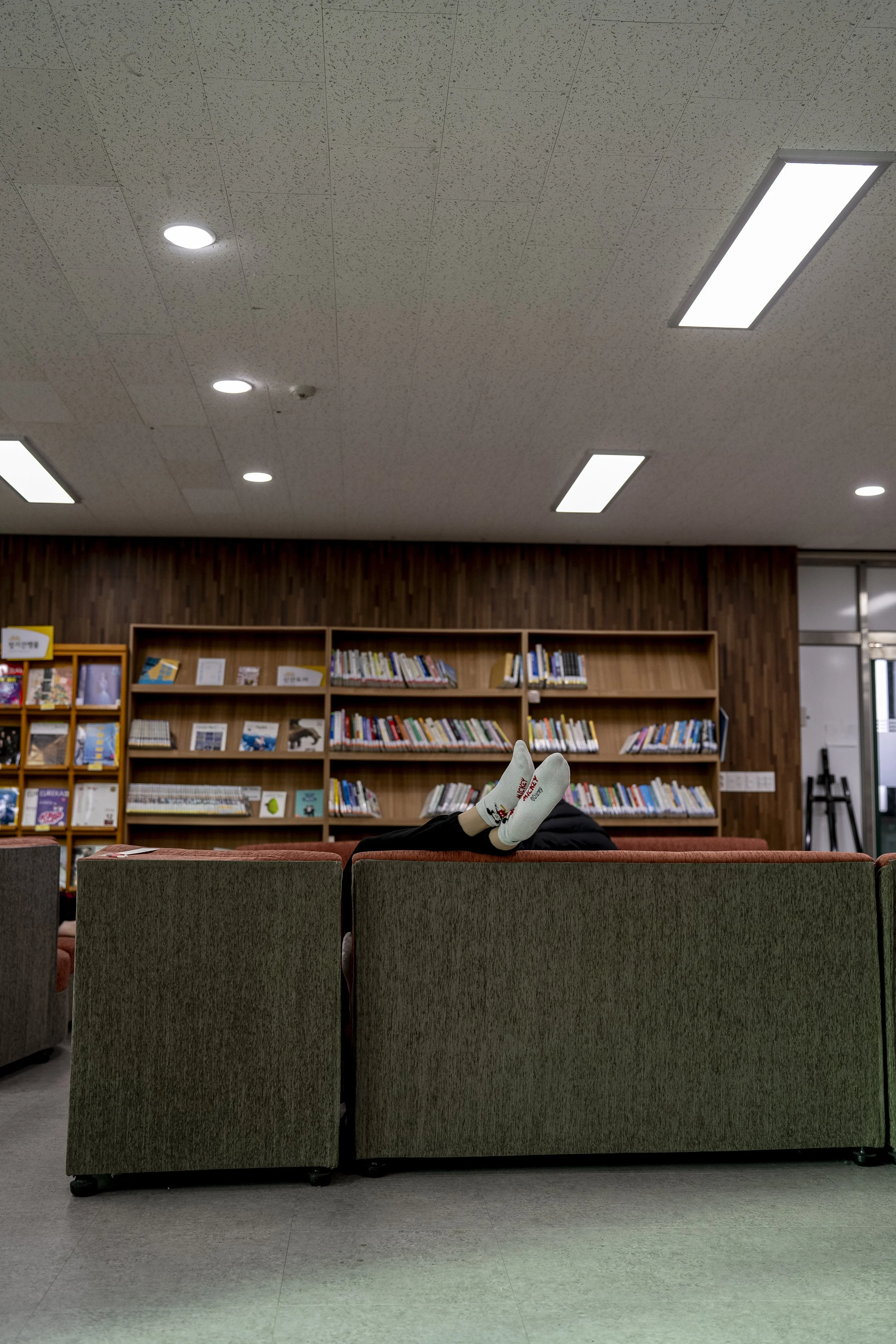 A final year student relaxes in the library, two days before graduation at Gimhae Girls’ High School.