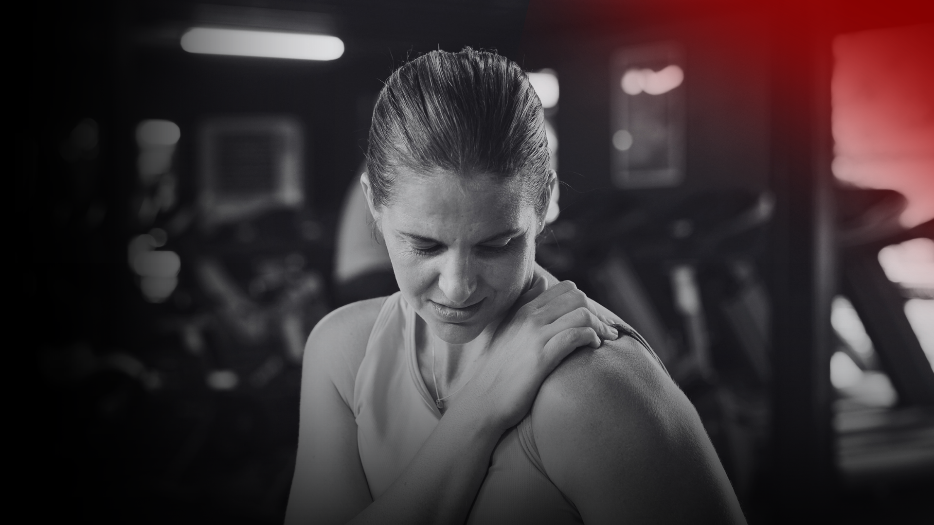 A woman experiencing Delayed Onset Muscle Soreness (DOMS) after a workout