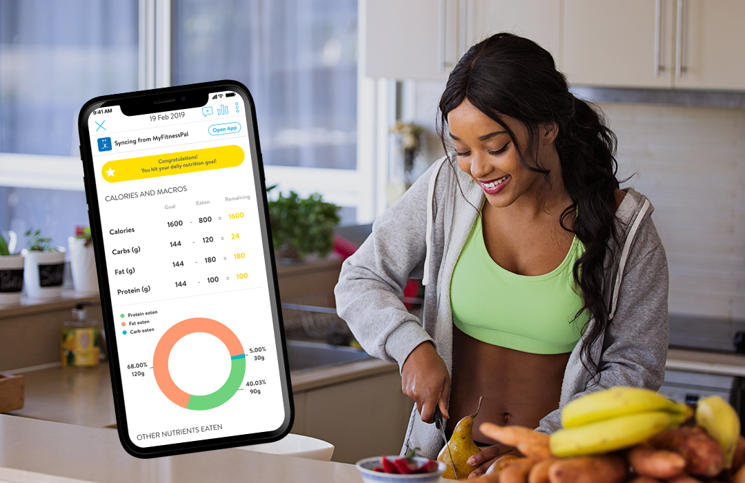 SoFit client prepping meals using a digital nutrition plan, part of the SoFit nutrition coaching system that supports fat loss and energy balance.