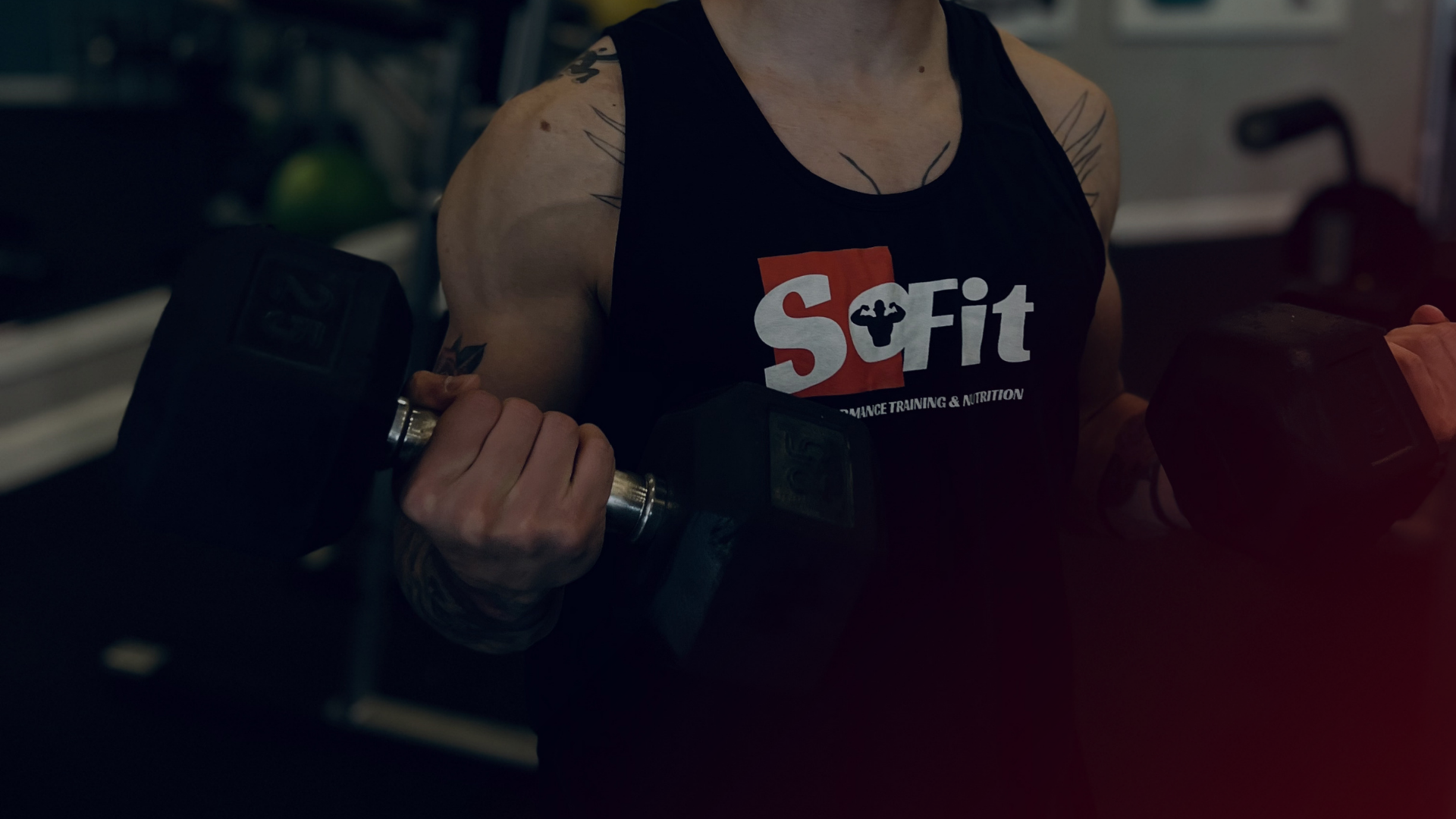 Busy professional lifting weights at SoFit