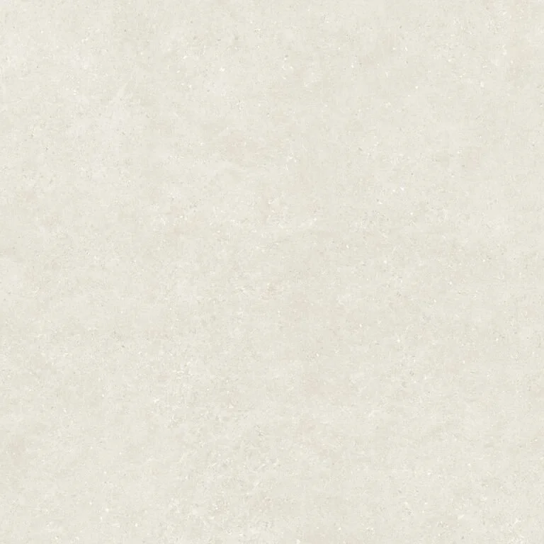 Une surface beige ou très claire, probablement du papier ou du tissu, avec une texture fine et uniforme.