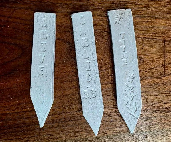 Example of pre-glazed clay garden markers.