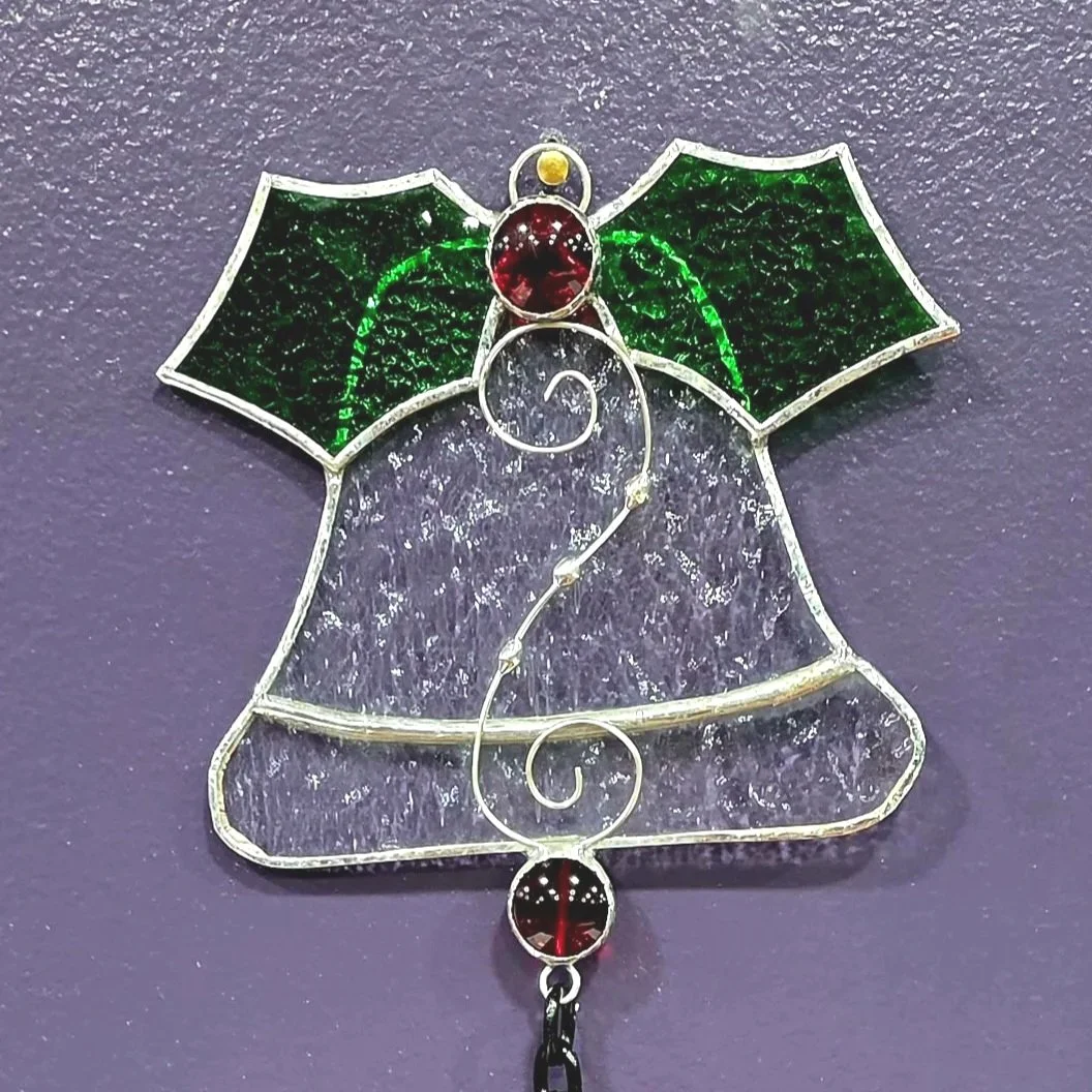 Example of the large stained glass bell at the top of the chain decoration.
