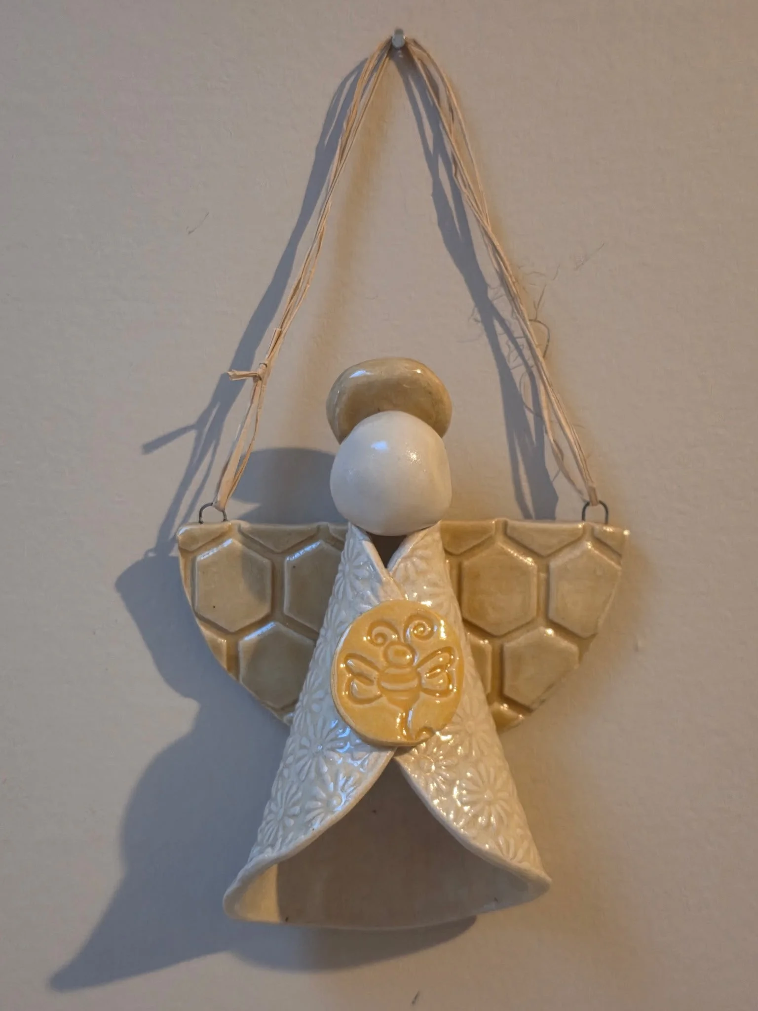 Ceramic angel decor in white.