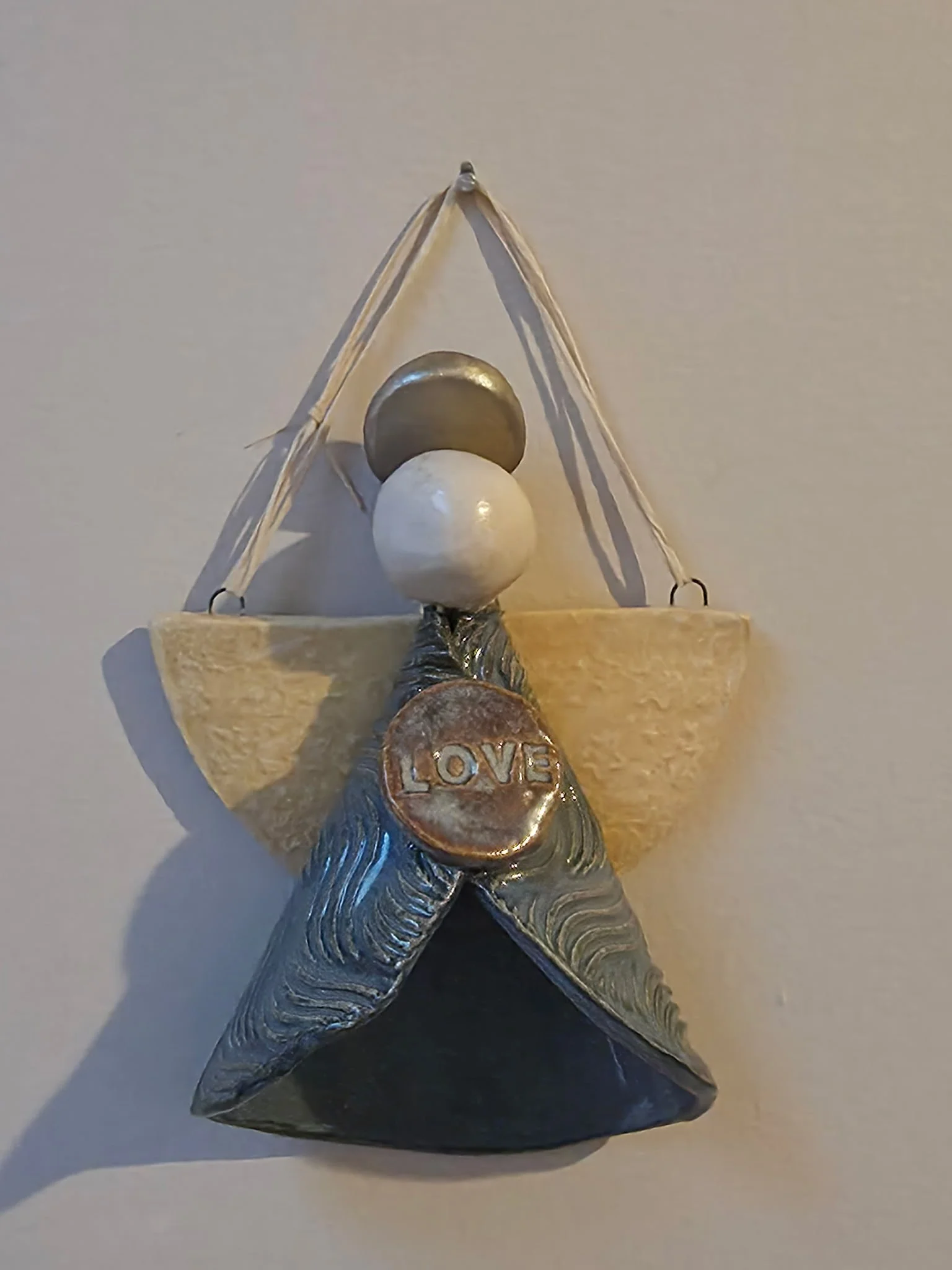 Ceramic angel decor in blue.