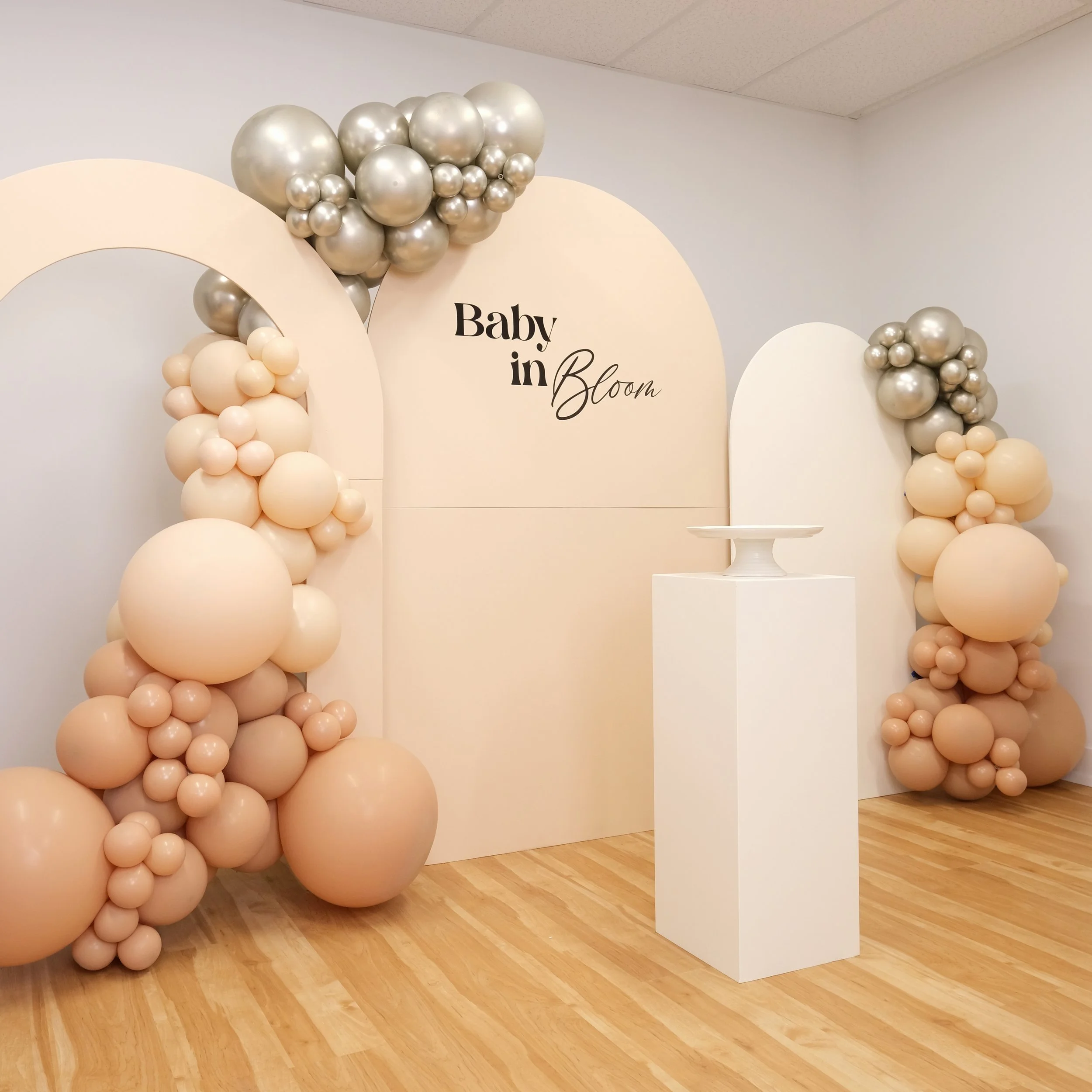 beige white arch baby shower white gold balloons