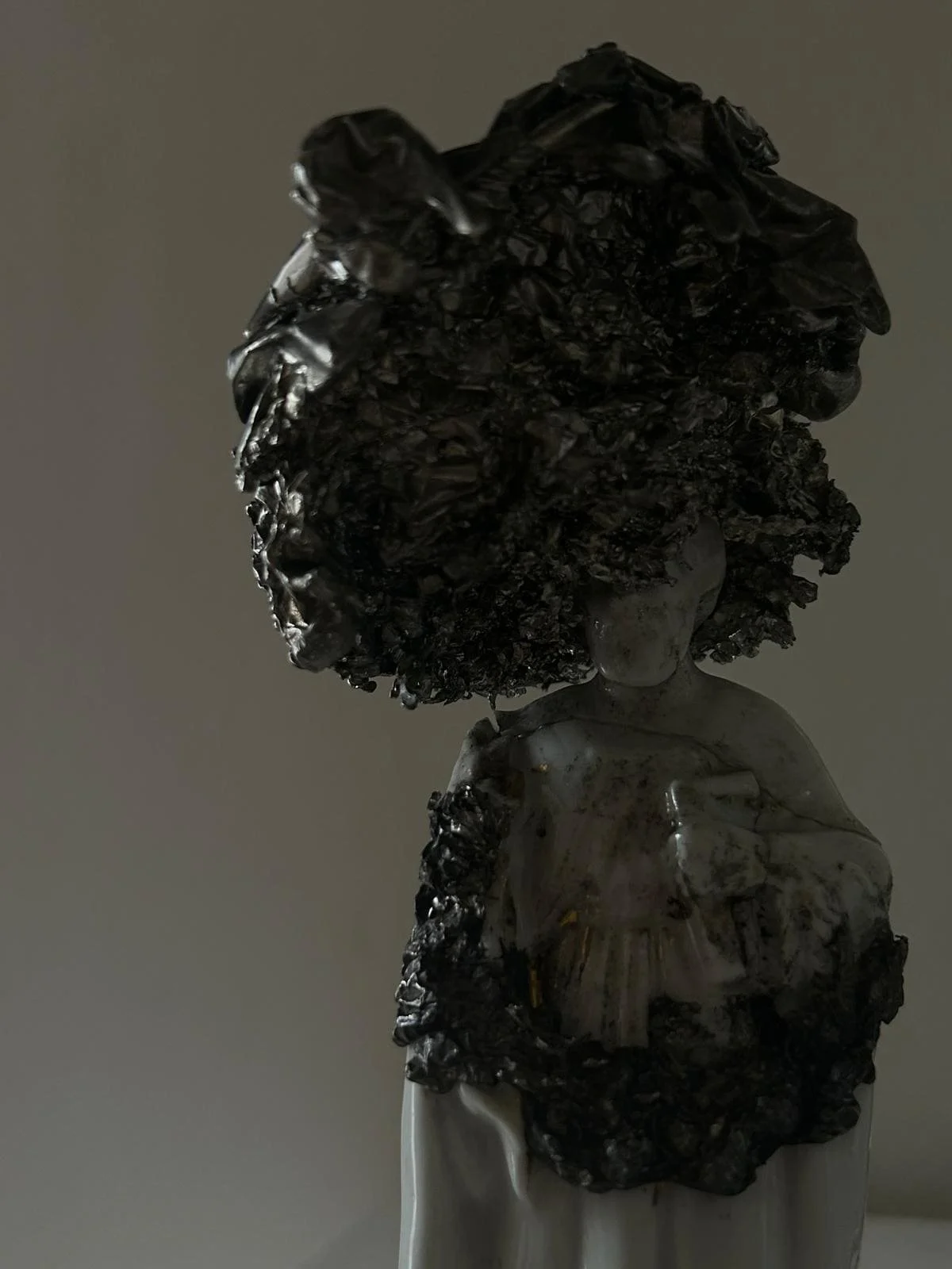 DAVID CLARKE'S  sculpture of a woman with large, textured hair and a detailed dress at STUDIO RÖ.